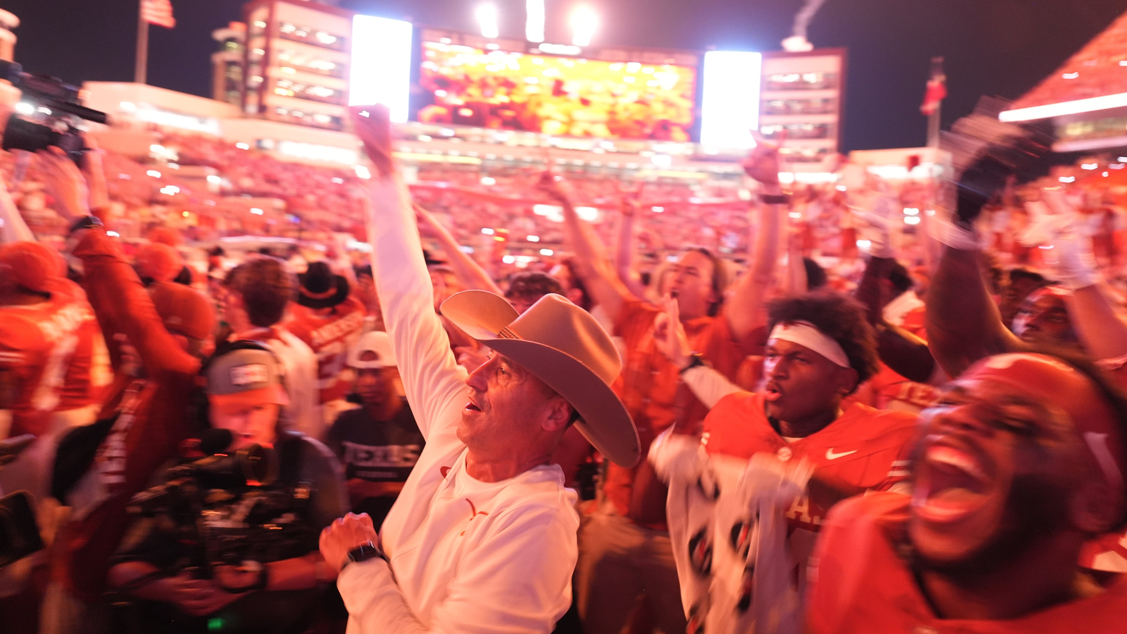 Texas head coach Steve Sarkisian, center and Texas players celebrate their win over Ohio State in an NCAA college football game in Austin, Texas, Saturday, Sept. 12, 2026. (AP Photo/Eric Gay)