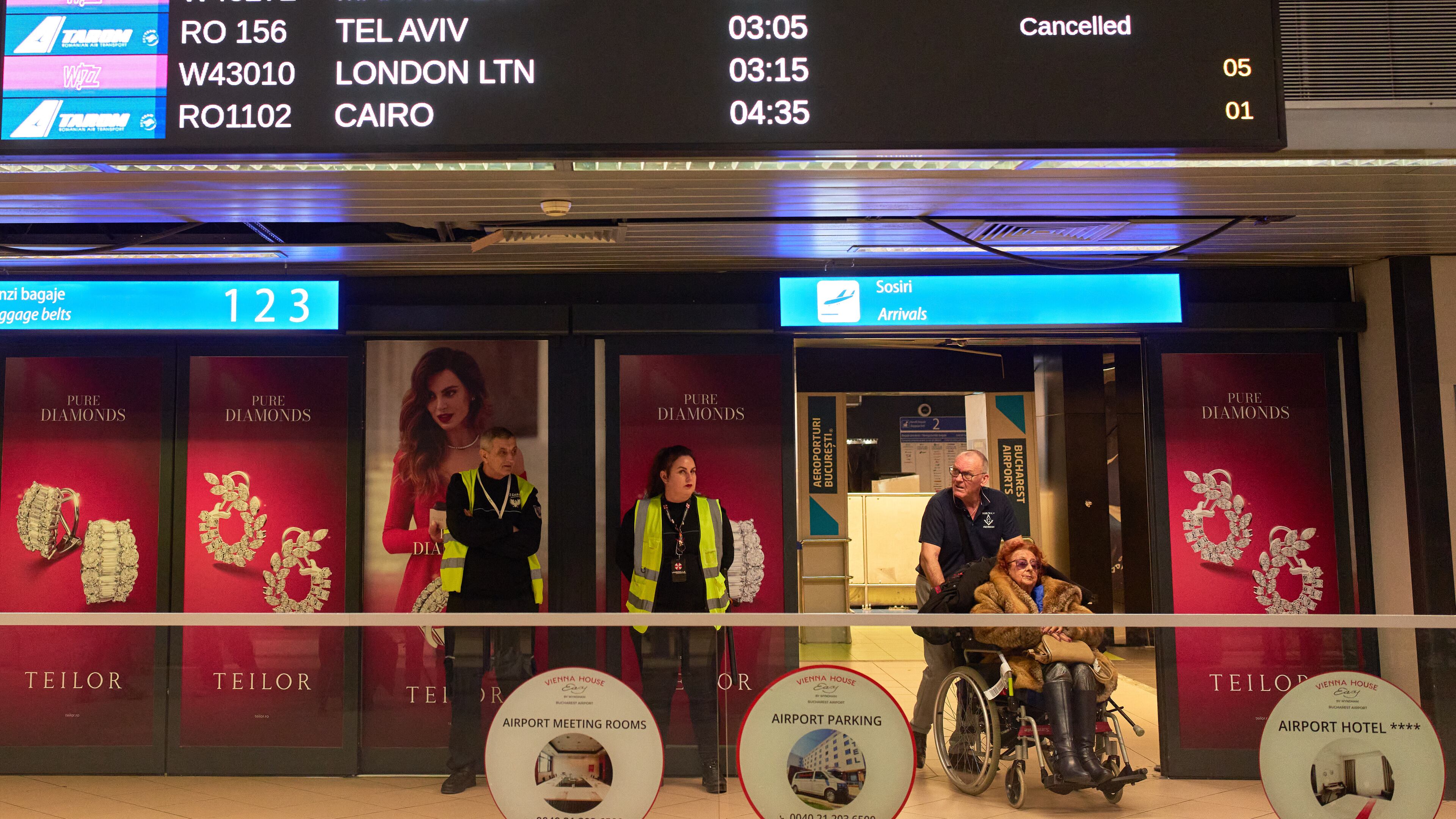 A display in the arrivals terminal of the Henri Coanda International Airport shows cancelled flights originating in Middle East countries, in Otopeni, Romania, Tuesday, March 3, 2026. (AP Photo/Vadim Ghirda)