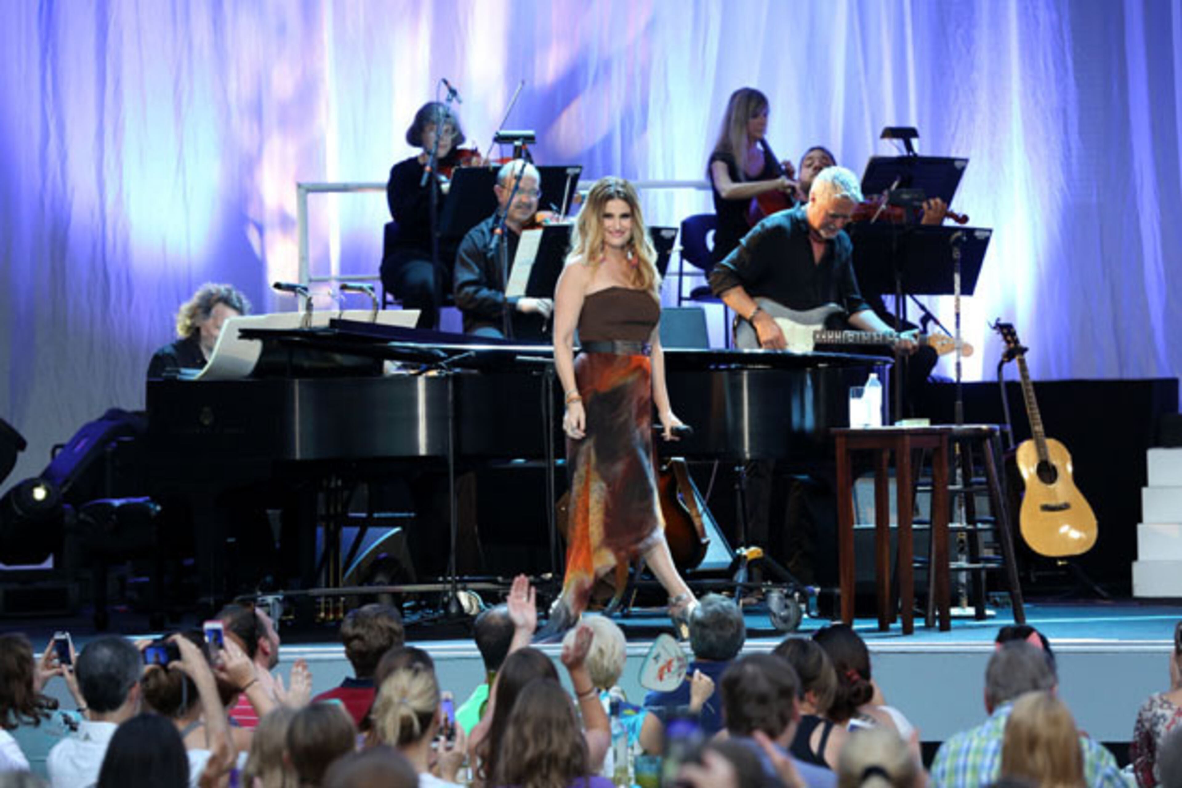 Actress and singer Idina Menzel entertained a large crowd At Chastain Park on Friday night, July 24, 2015. Known for her roles on Broadway in "Rent" and "Wicked". Menzel also was a member of the cast in the TV series "Glee", portraying Skelby Corcoran. The Tony Award winner is recently known for the song "Let It Go" from the film "Frozen." Robb D. Cohen /.RobbsPhotos.com