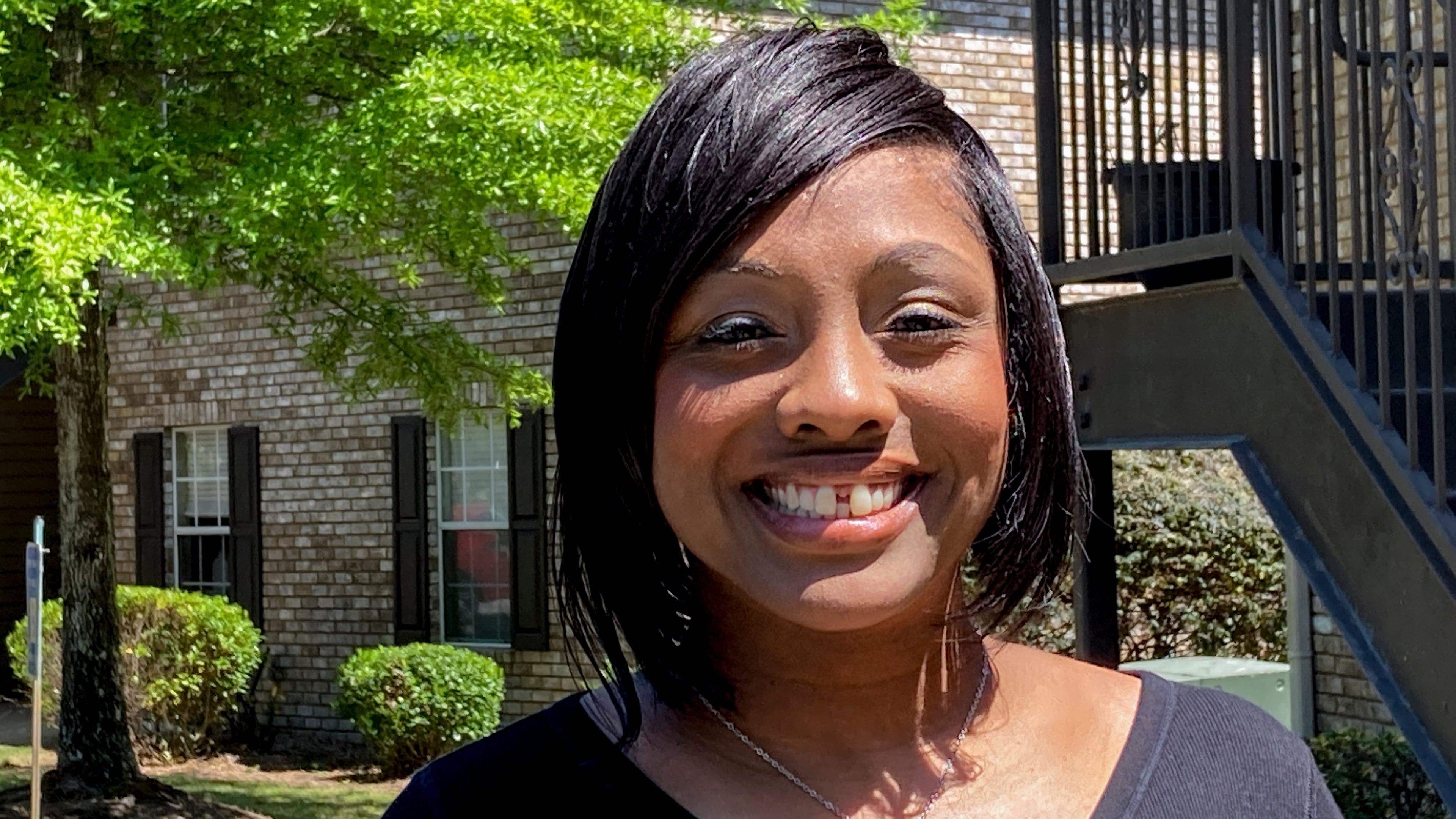 Ashley Jordan, previously known as Ashley Debelbot, poses for a photo for a photo in Columbus, Ga., on April 22, 2021. The 11th season of the AJC's 'Breakdown' podcast covered the case of Ashley Jordan and Albert Debelbot, a then-married couple convicted of murdering their newborn daughter. The two spent 12 years in prison before their convictions were overturned in 2020, but a judge ruled Wednesday that they are eligible for compensation under Georgia's new wrongful conviction compensation law. (Kate Brumback/AP 2021)