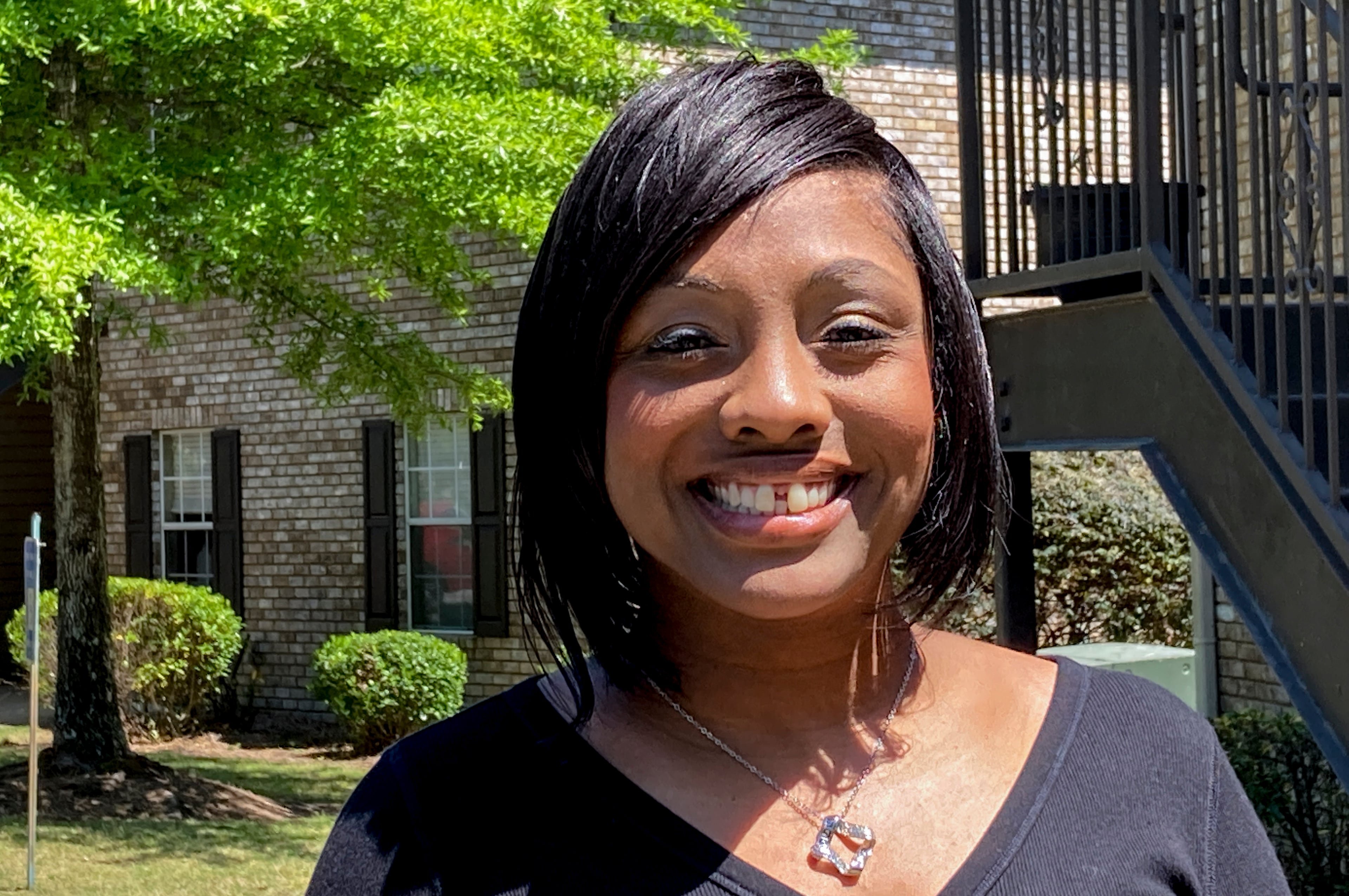 Ashley Jordan, previously known as Ashley Debelbot, poses for a photo for a photo in Columbus, Ga., on April 22, 2021. The 11th season of the AJC's 'Breakdown' podcast covered the case of Ashley Jordan and Albert Debelbot, a then-married couple convicted of murdering their newborn daughter. The two spent 12 years in prison before their convictions were overturned in 2020, but a judge ruled Wednesday that they are eligible for compensation under Georgia's new wrongful conviction compensation law. (Kate Brumback/AP 2021)