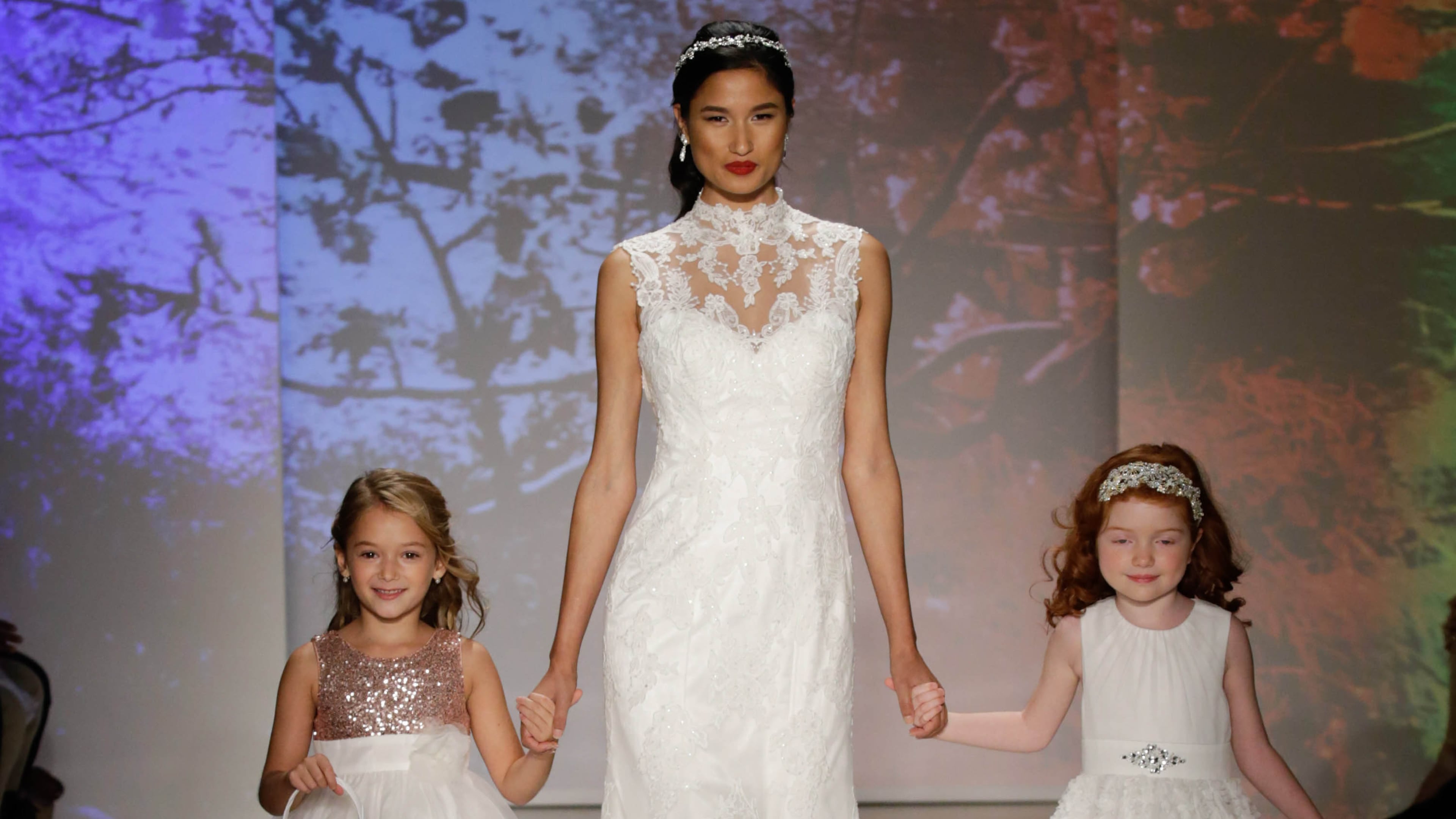 NEW YORK, NY - OCTOBER 05: Models walk the runway at the Alfred Angelo Spring 2017 Bridal Show with Disney Weddings at EZ Studios on October 5, 2016 in New York City. (Photo by JP Yim/Getty Images for Alfred Angelo)