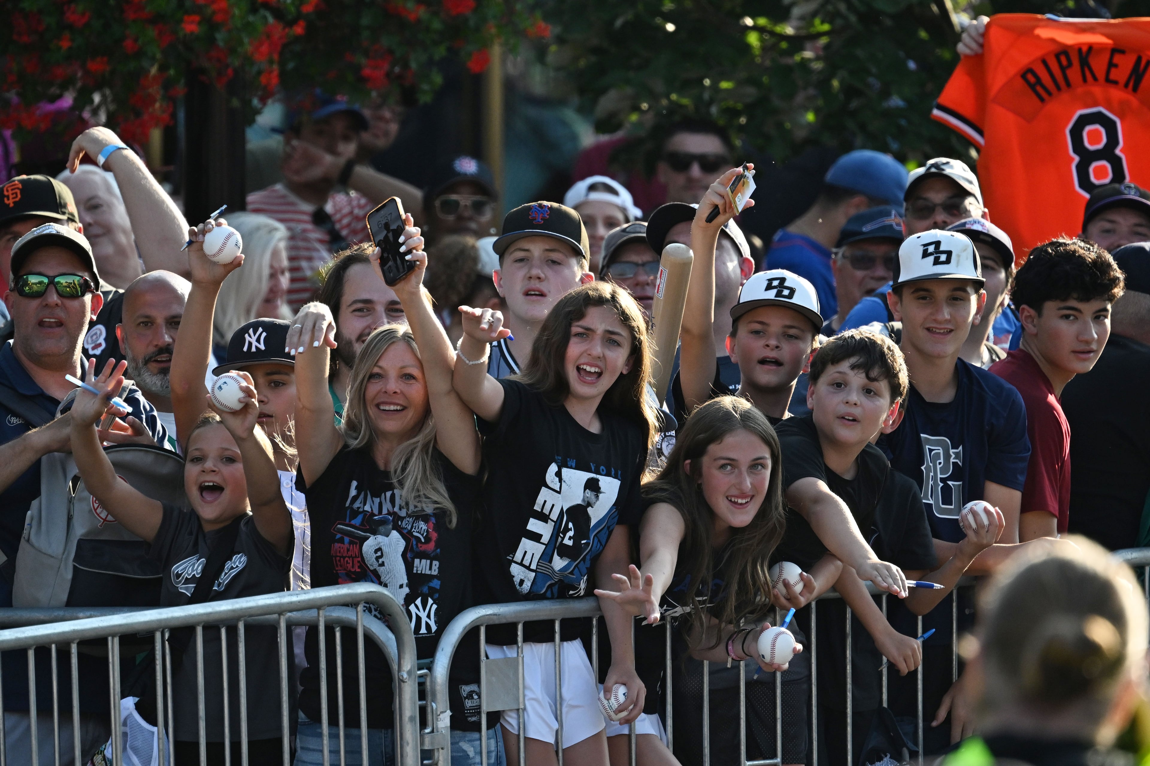 Baseball fans react during the Hall of Fame Legends Parade on Saturday, July 25, 2026, in Cooperstown, N.Y. Andruw Jones will be inducted into the National Baseball Hall of Fame on Sunday as part of the Class of 2026, alongside Carlos Beltrán and Jeff Kent. (Hyosub Shin/AJC)