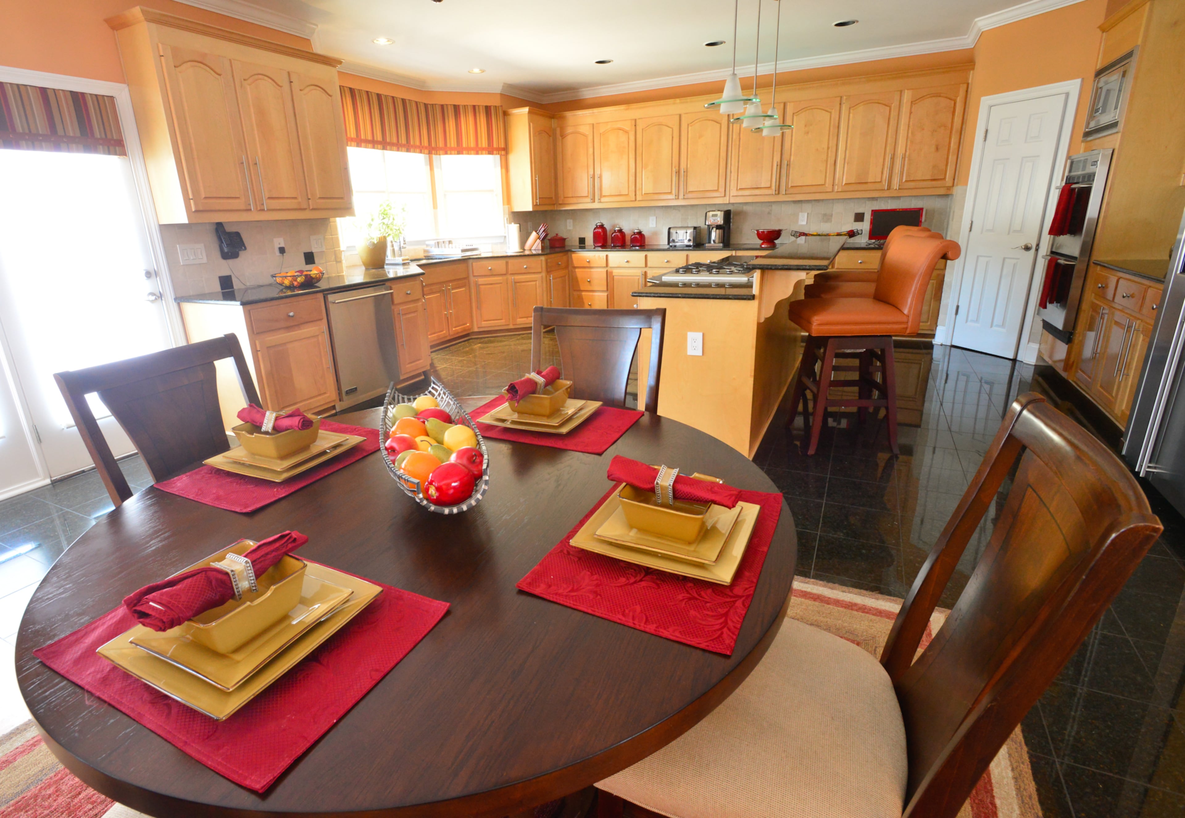 Shawn Evans Mitchell loves the "oversized" kitchen, which has granite tile on the floor, Viking Professional Series appliances and an island with comfortable bar stools.
