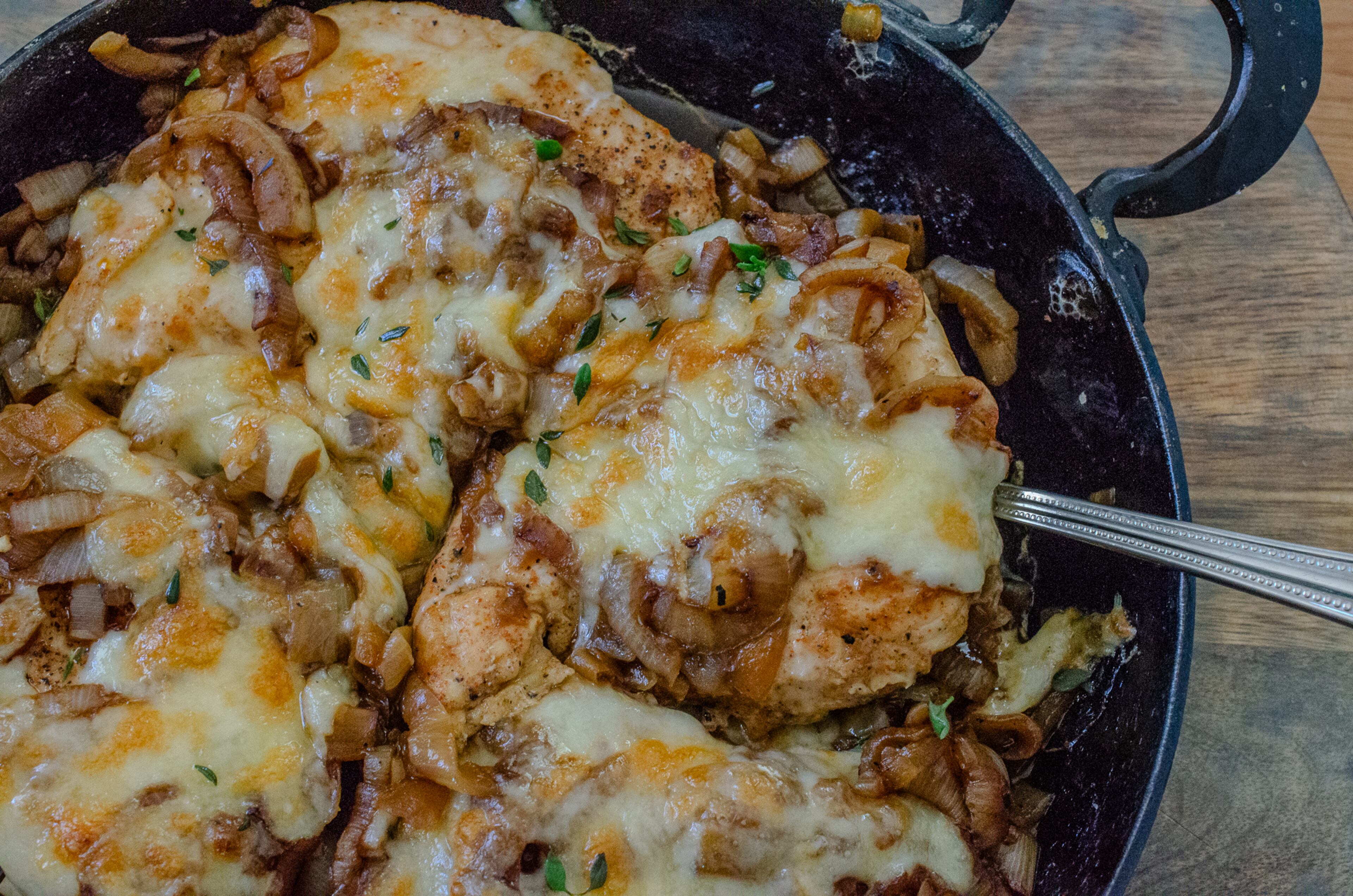 Speedy French Onion Chicken is a tantalizing combination of baked chicken, caramelized onions and golden melted cheese. (Virginia Willis for the AJC)