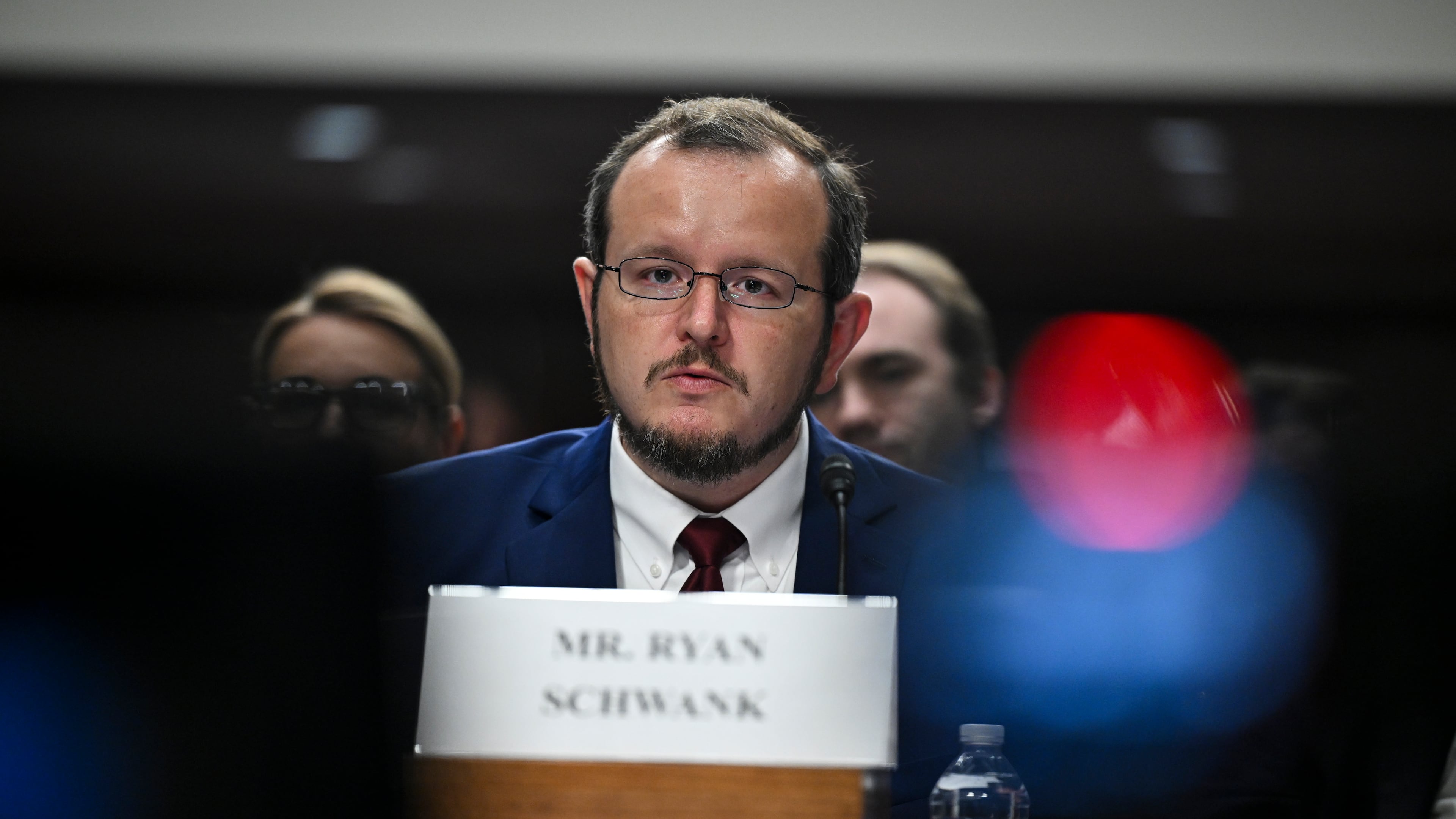 Ryan Schwank, a former ICE lawyer who worked at the federal government’s law enforcement training academy, testified in Washington last month about significant reductions in instructional hours for ICE recruits. “For the last five months, I watched ICE dismantle the training program,” he said. (Kenny Holston/The New York Times)