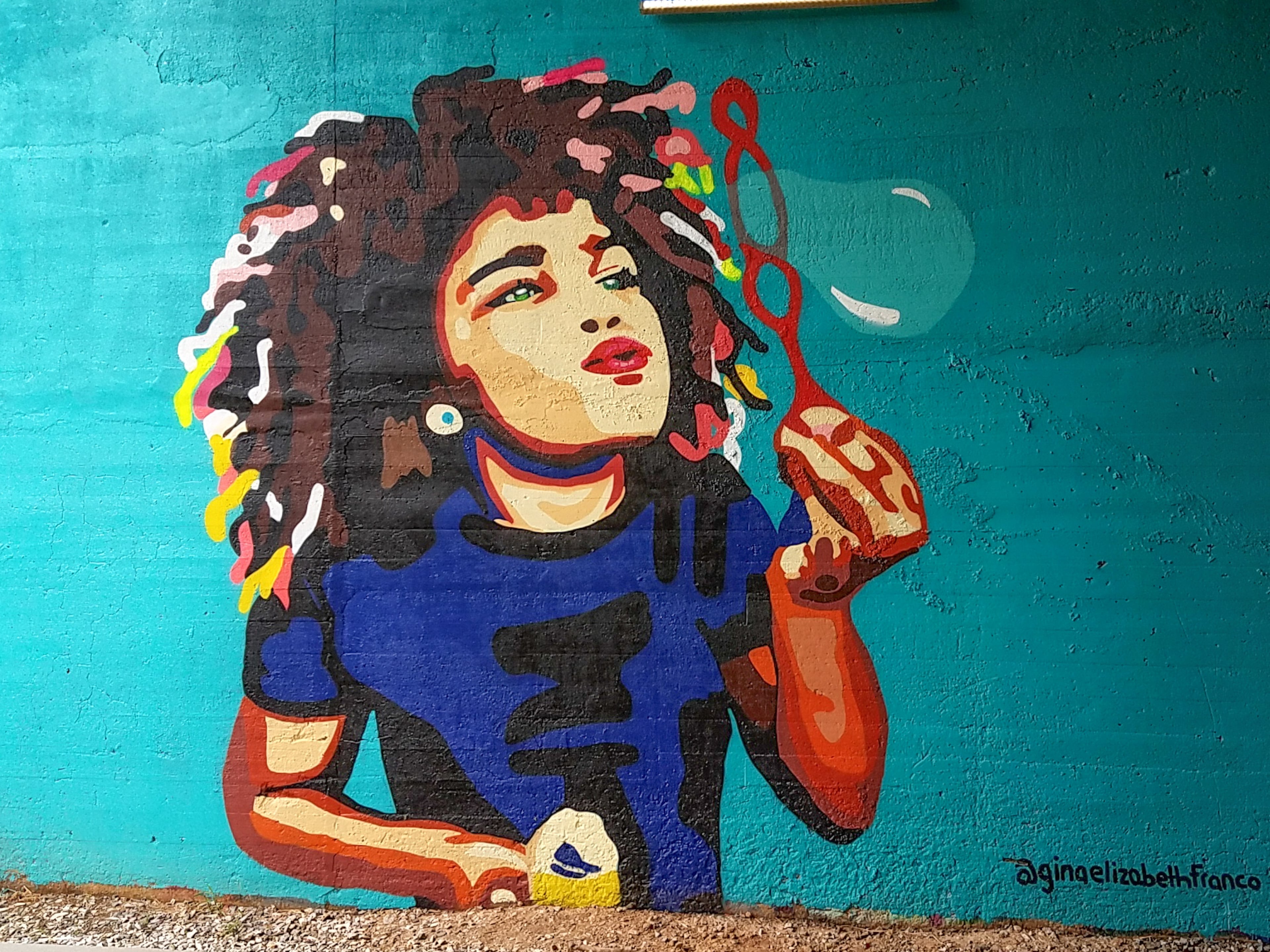 The girl blowing bubbles is the artist Gina Elizabeth Franco’s niece Jayla.