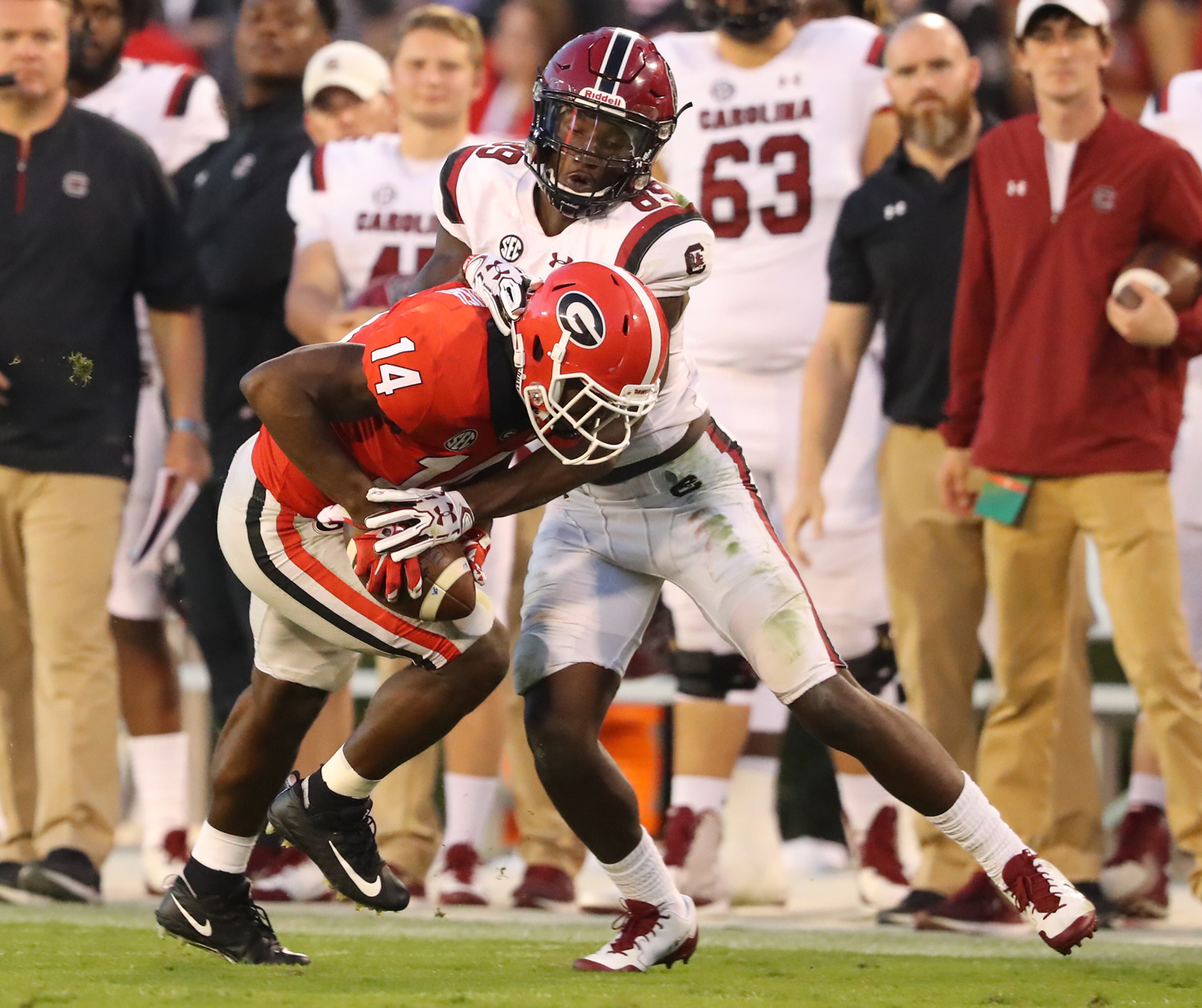 November 4, 2017 Athens: Malkom Parrish intercepts South Carolina quarterback Jake Bentley in front of wide receiver Bryan Edwards in the final minutes of the game for a 24-10 victory and a 9-0 record in a NCAA college football game on Saturday, November 4, 2017, in Athens. Curtis Compton/ccompton@ajc.com