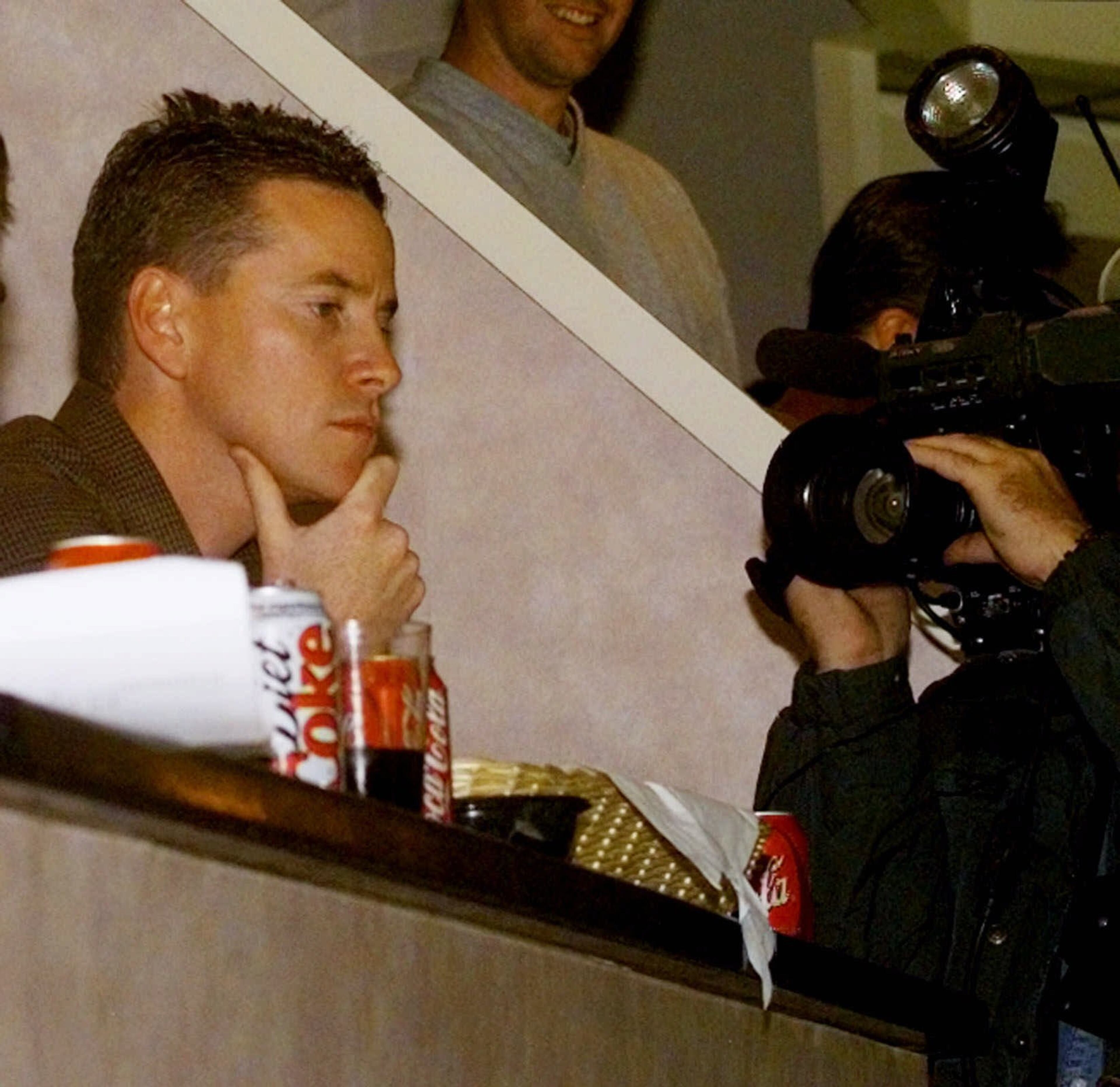 Braves pitcher Tom Glavine watches a hockey game between the New York Islanders and the Atlanta Thrashers at Nassau Coliseum in Uniondale, N.Y. Thursday, Oct. 14, 1999.