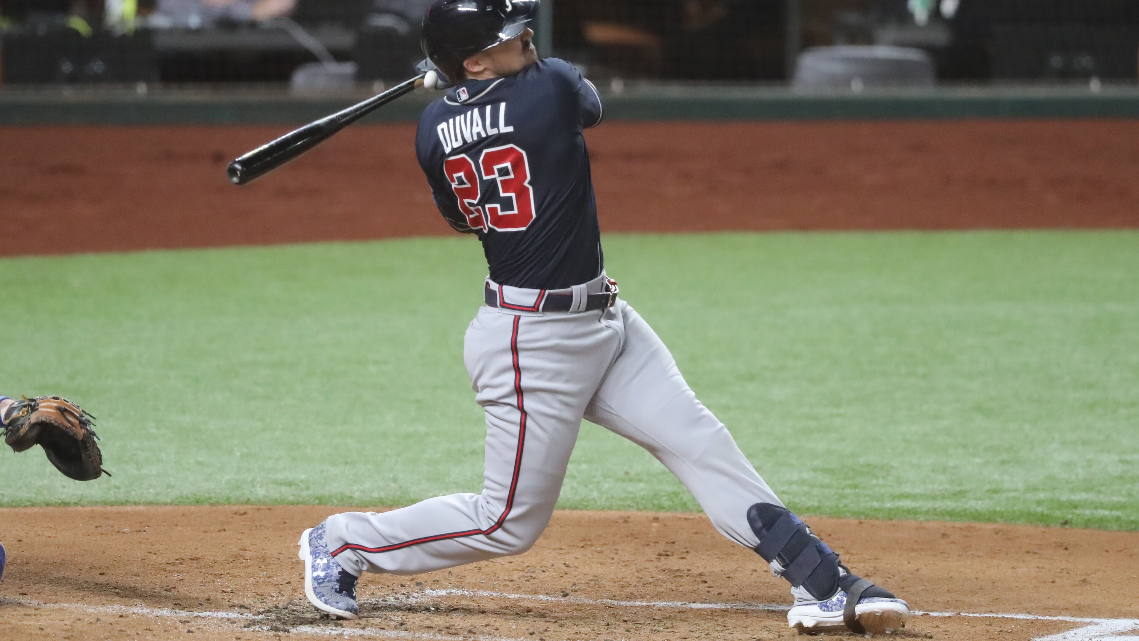 Atlanta Braves left fielder Adam Duvall gets injured on this swing against the Los Angeles Dodgers during the second inning in Game 1 Monday, Oct. 12, 2020, for the best-of-seven National League Championship Series at Globe Life Field in Arlington, Texas. Duvall had to leave the game. (Curtis Compton/Atlanta Journal-Constitution/TNS)