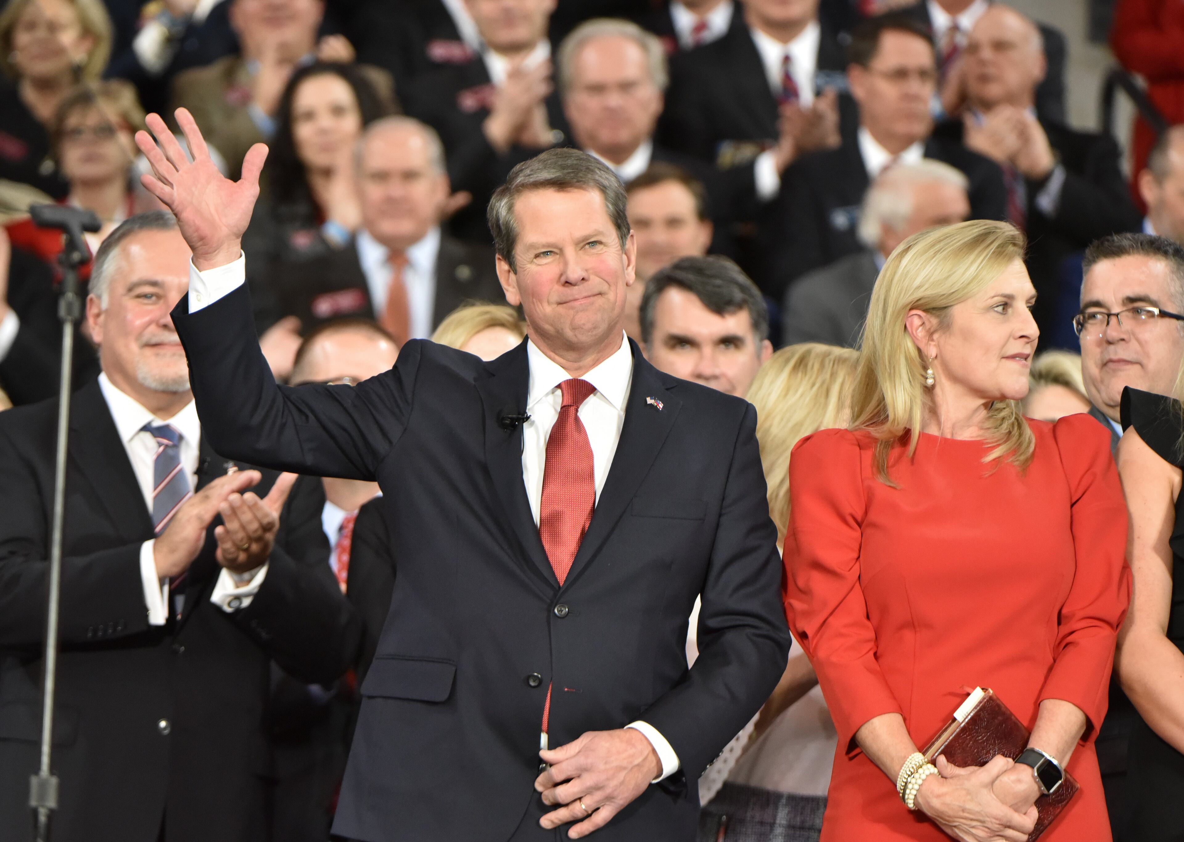 January 14, 2019 Atlanta - Brian Kemp with wife Marty Kemp waves to supporters during the swearing-in ceremony at McCamish Pavilion in Campus of Georgia Tech on Monday, January 14, 2019. HYOSUB SHIN / HSHIN@AJC.COM