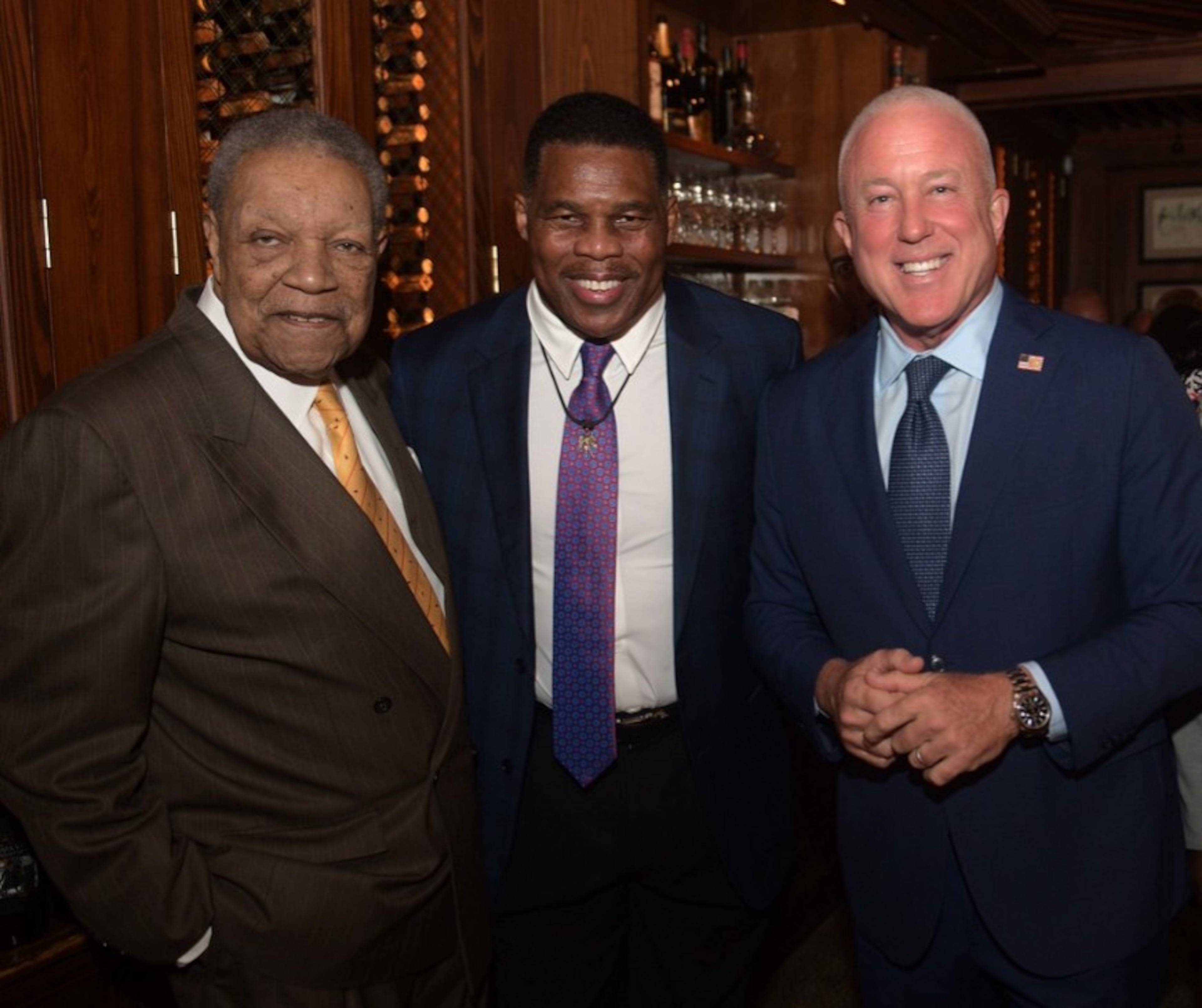(Left to right): Fulton County Commission Chairman Robb Pitts attended the recent farewell dinner in Buckhead for Herschel Walker and Bill White, who are now U.S. ambassadors.