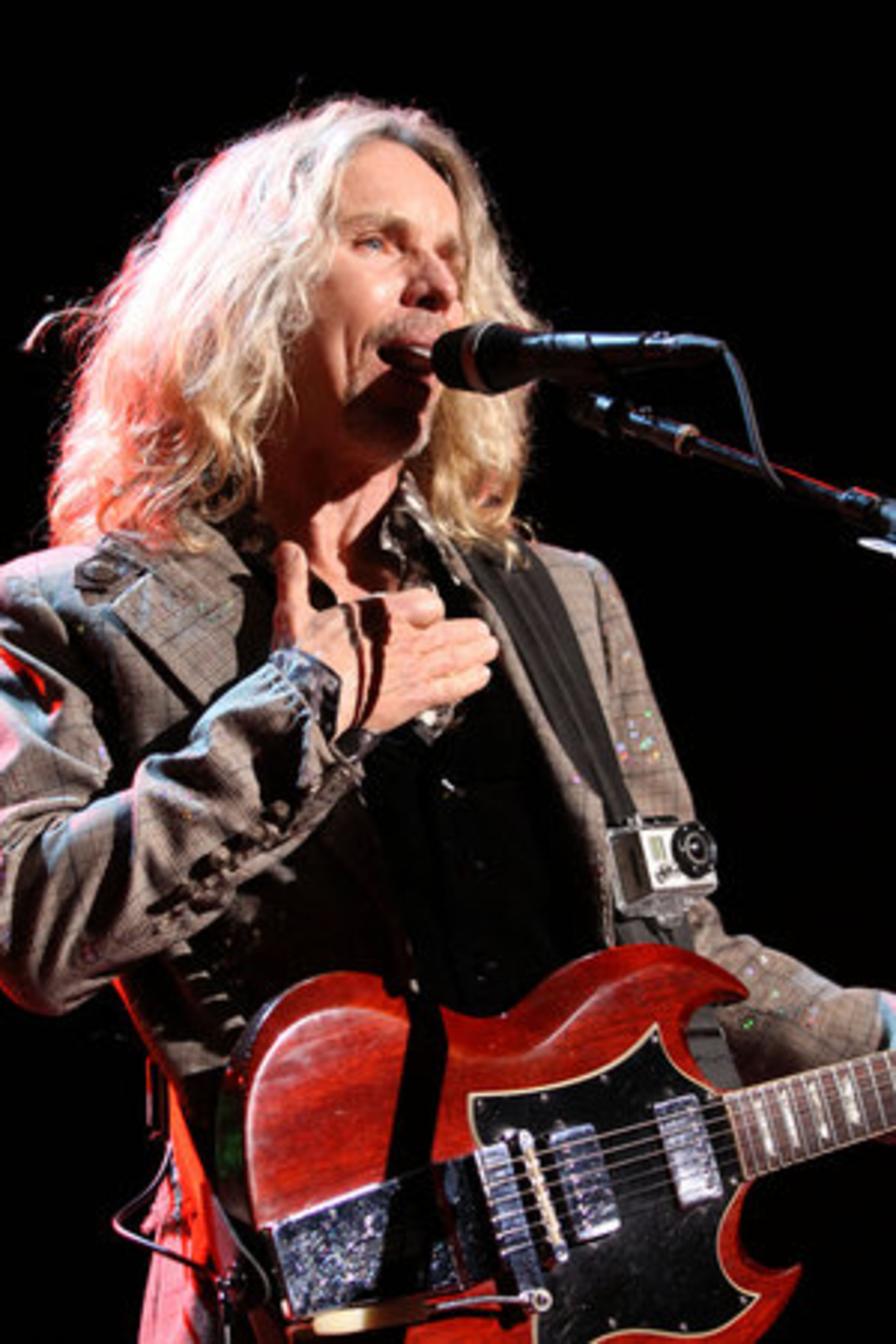 Tommy Shaw performs the Styx hit "Grand Illusion" at Verizon Wireless Amphitheatre in Alpharetta. The "Midwest Rock-N-Roll Express" tour also featured REO Speedwagon and Ted Nugent.