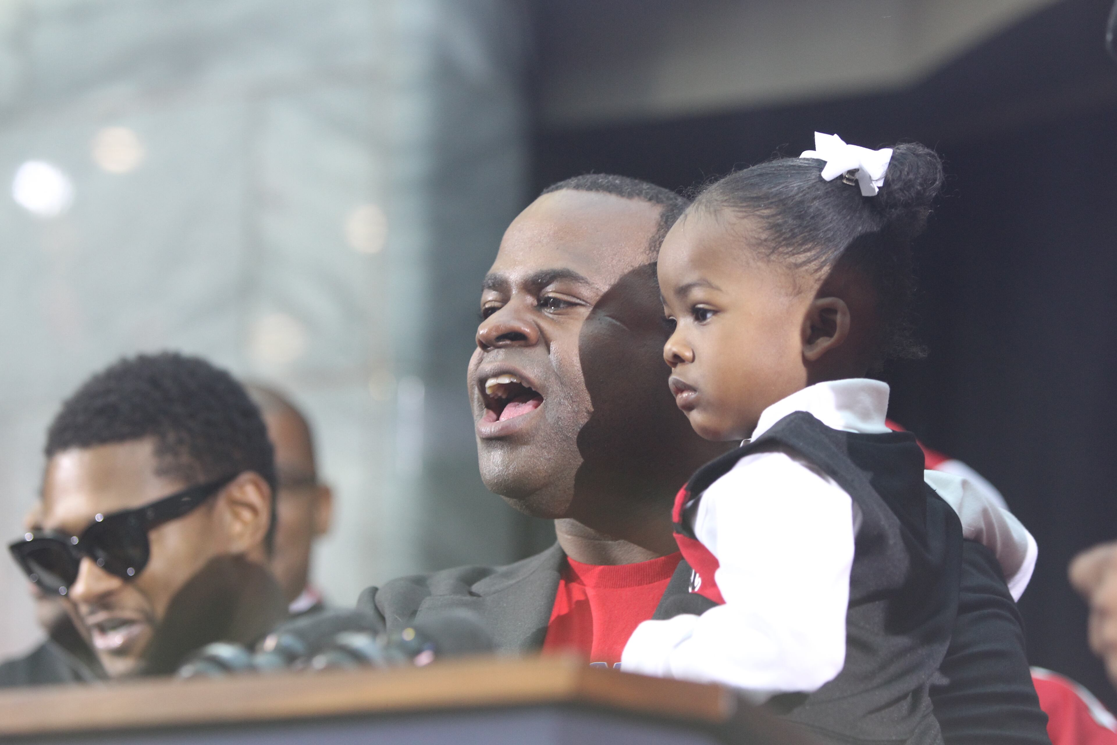 January 27, 2017, Atlanta, Georgia - Mayor Kasim Reed speaks to the crowd with his daughter in hand at the Atlanta Falcons pep rally held by Mayor Reed at City hall in Atlanta, Georgia, on Friday, January 27, 2017. (HENRY TAYLOR / HENRY.TAYLOR@AJC.COM)