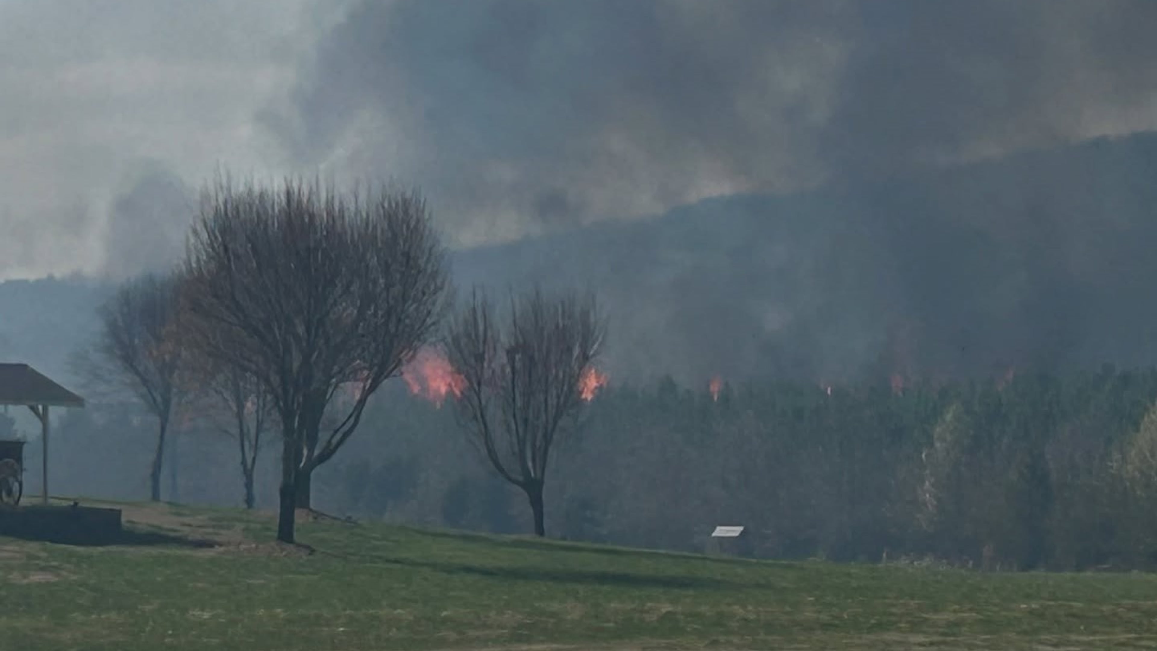 Firefighters in Floyd County battled a wildfire that engulfed several acres of forest that prompted evacuations Sunday.