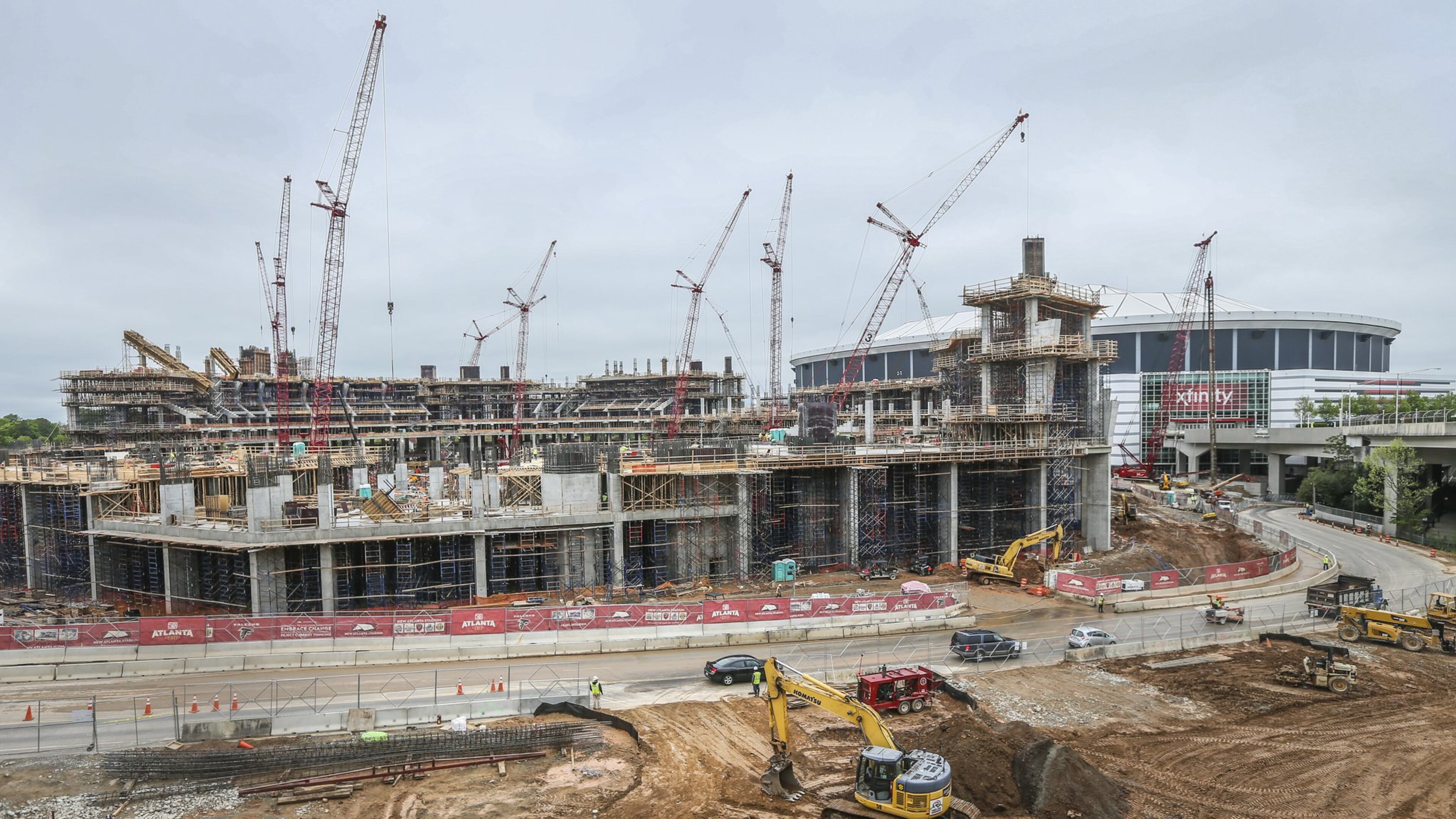 The new Falcons stadium, under construction next to the Georgia Dome, would be the site of college football’s national championship game in January 2018 if an Atlanta bid is successful. JOHN SPINK / JSPINK@AJC.COM