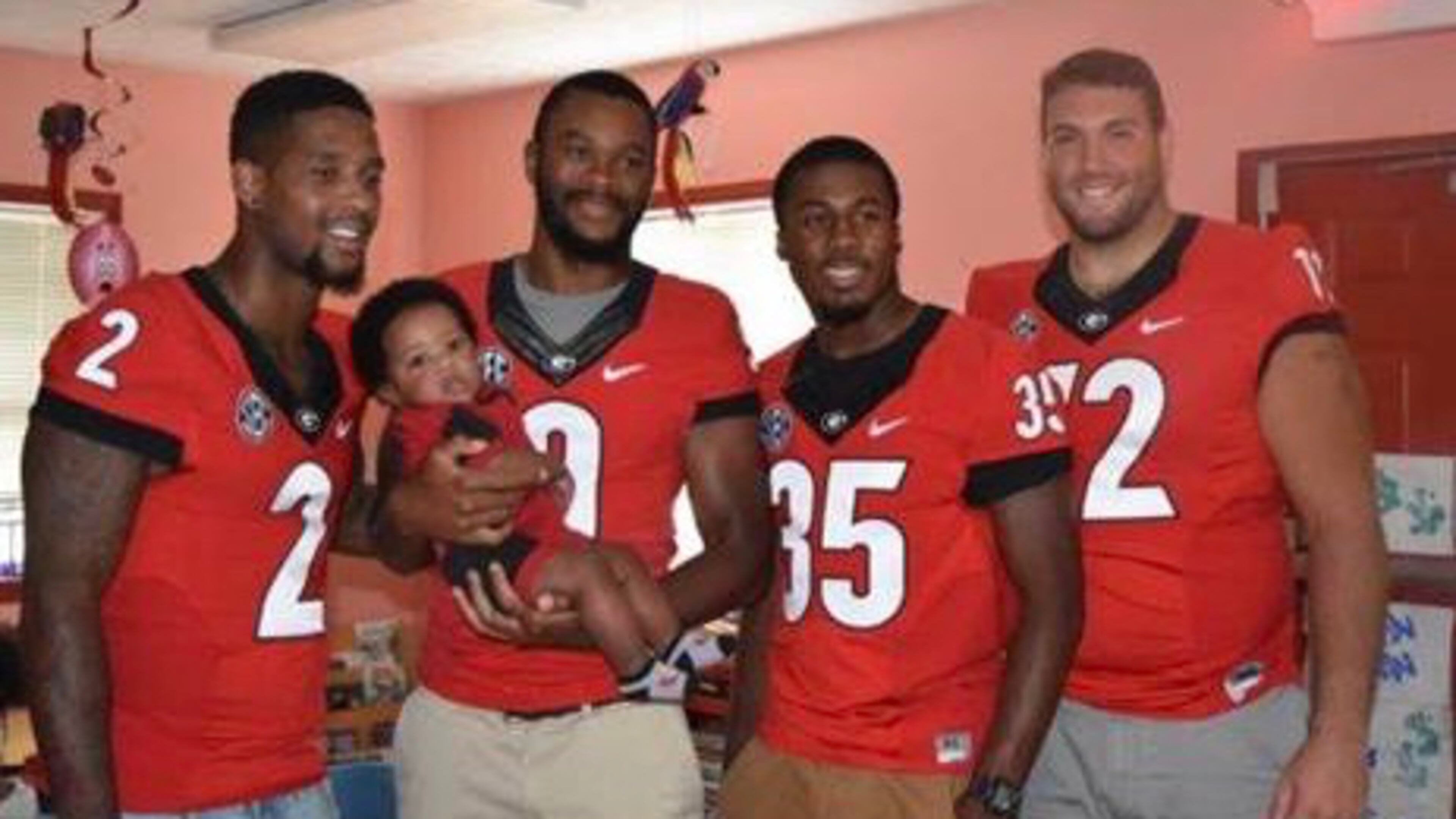 UGA safety Aaron Davis (second from right) is joined by teammates on a visit to St. Mary’s Hospital in Athens. Courtesy UGA Athletic Association