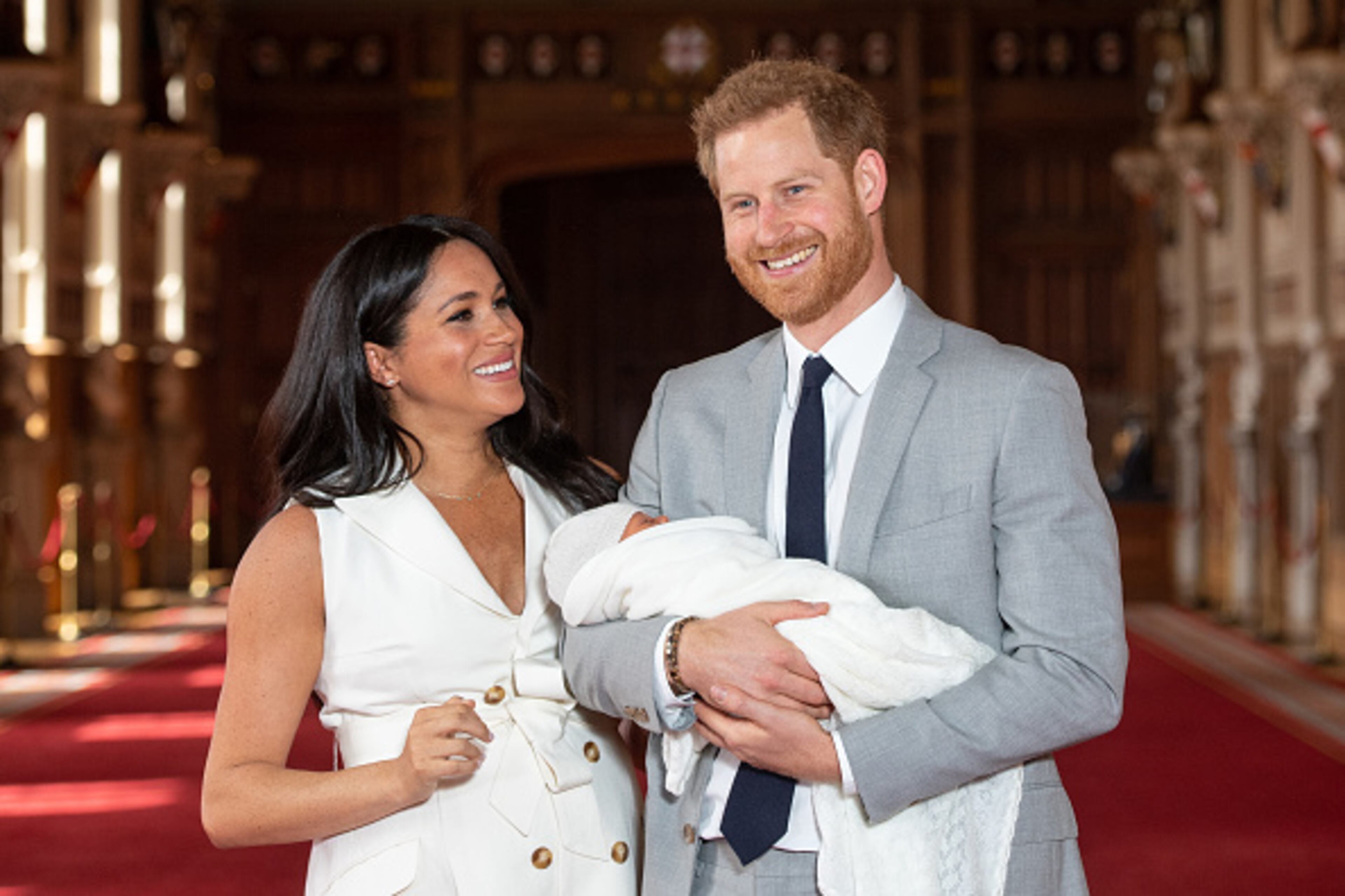 Prince Harry, Duke of Sussex and Meghan, Duchess of Sussex, pose with their newborn son during a photocall in St George's Hall at Windsor Castle on May 8, 2019 in Windsor, England. The Duchess of Sussex gave birth at 05:26 on Monday 06 May, 2019.