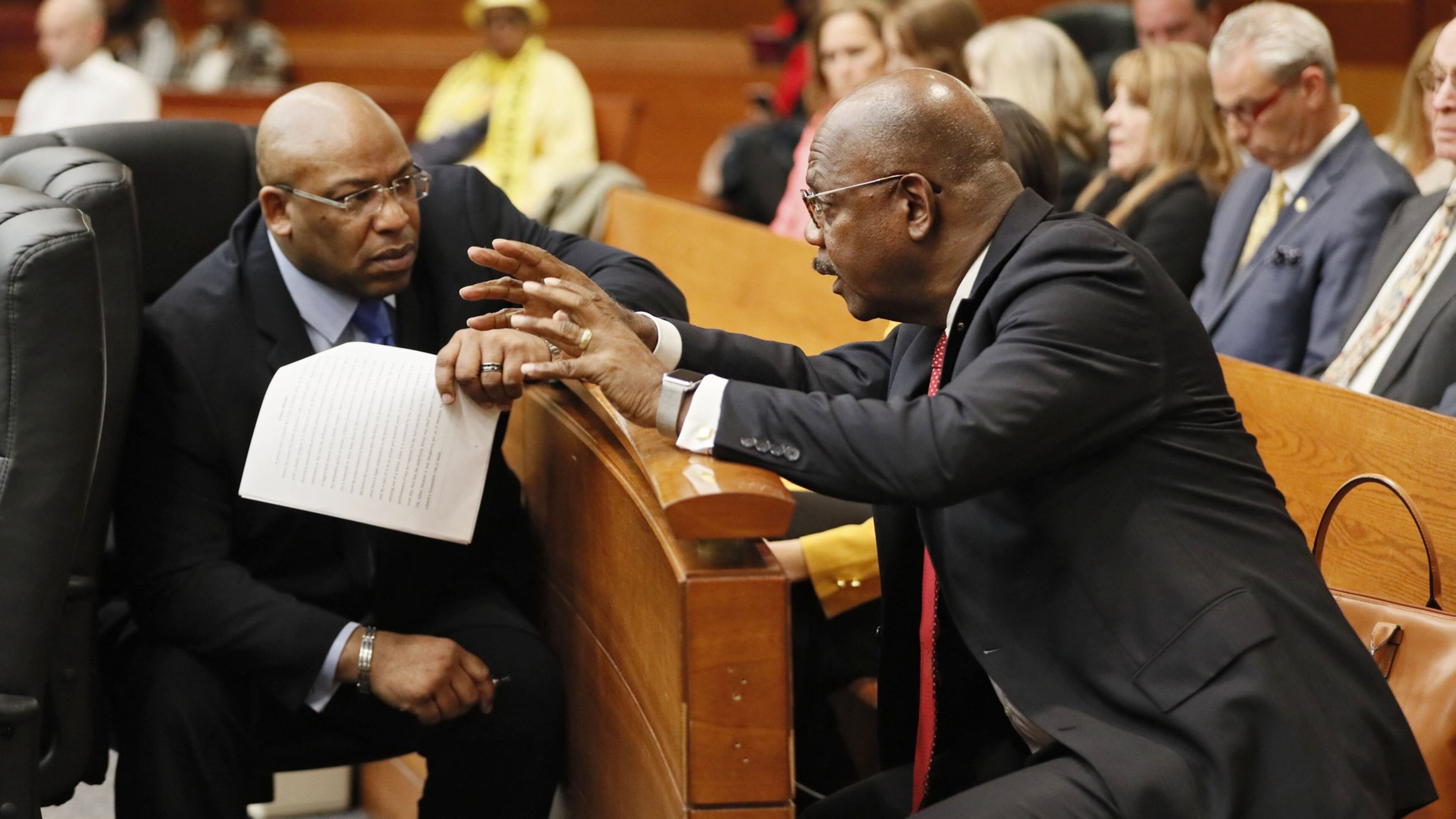 Chief Assistant District Attorney Clint Rucker (left) talks with Fulton County District Attorney Paul Howard, Jr. during the Tex McIver murder trial at the Fulton County Courthouse. Bob Andres bandres@ajc.com AJC FILE PHOTO