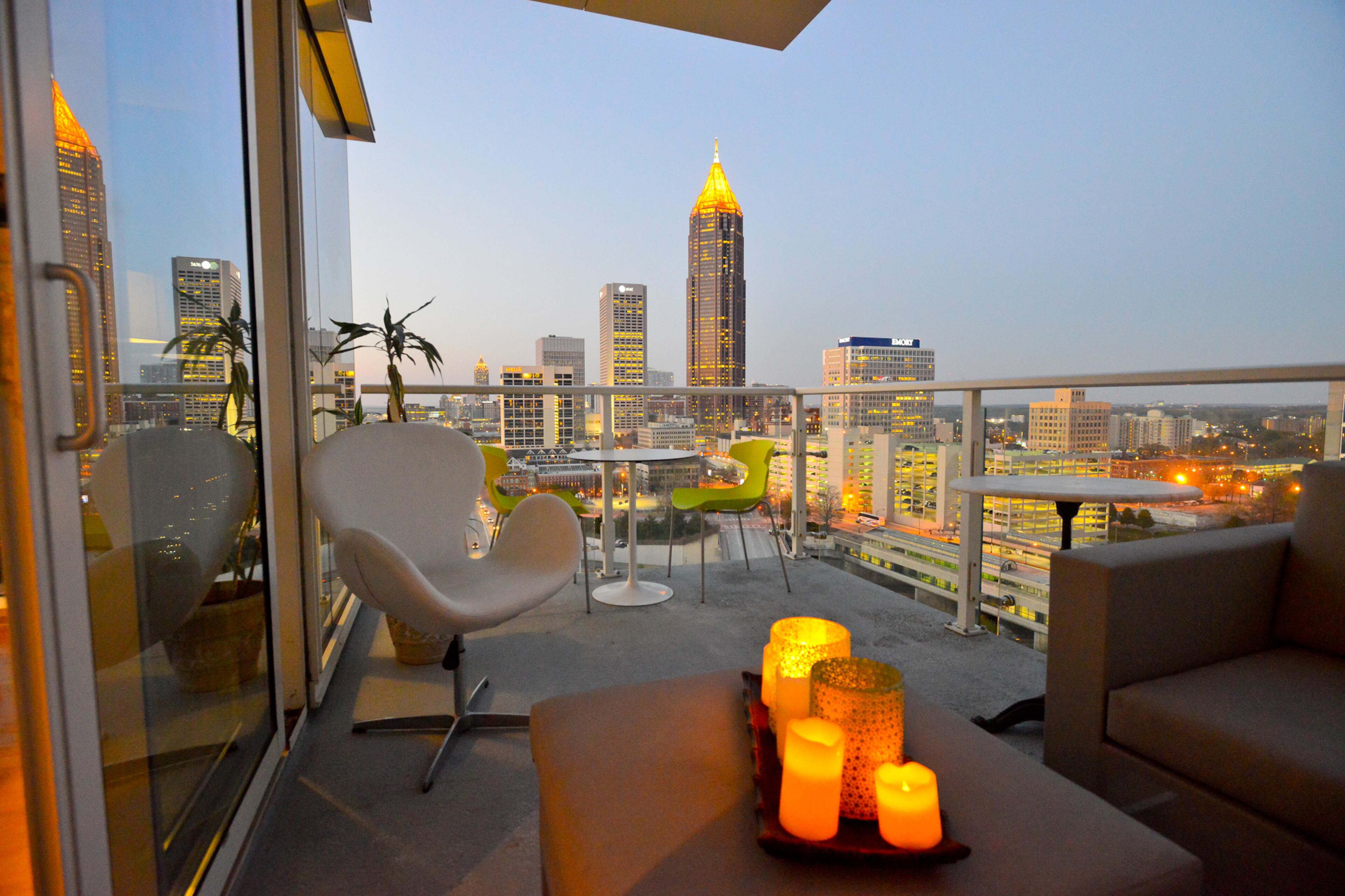 A custom modern outdoor sectional from Authenteak looks like interior furniture but is durable for a city terrace. Condo owner Marc Castillo plans to add faux grass to his outdoor space at the The Residences at W Atlanta - Downtown. (Christopher Oquendo Photography)