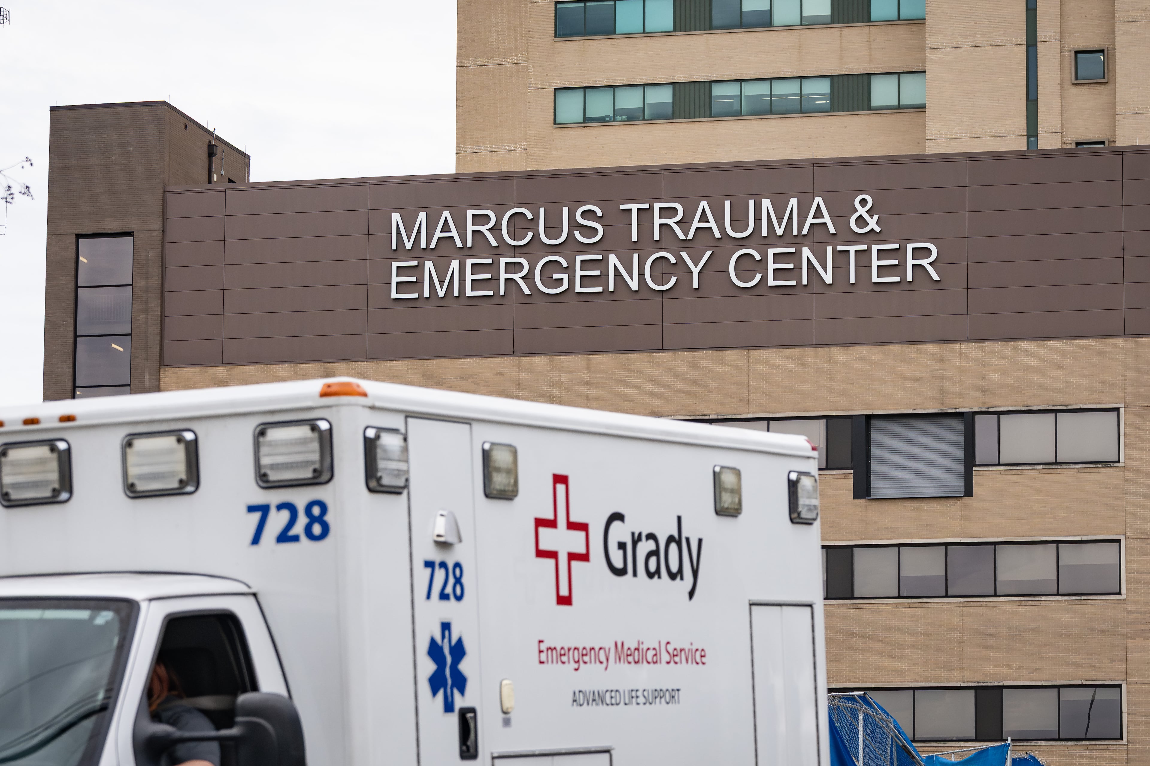 A ambulance leaves the parking bay outside the Marcus Trauma and Emergency Center at Grady Memorial Hospital on Friday, May 1, 2026. (Ben Hendren for the AJC)