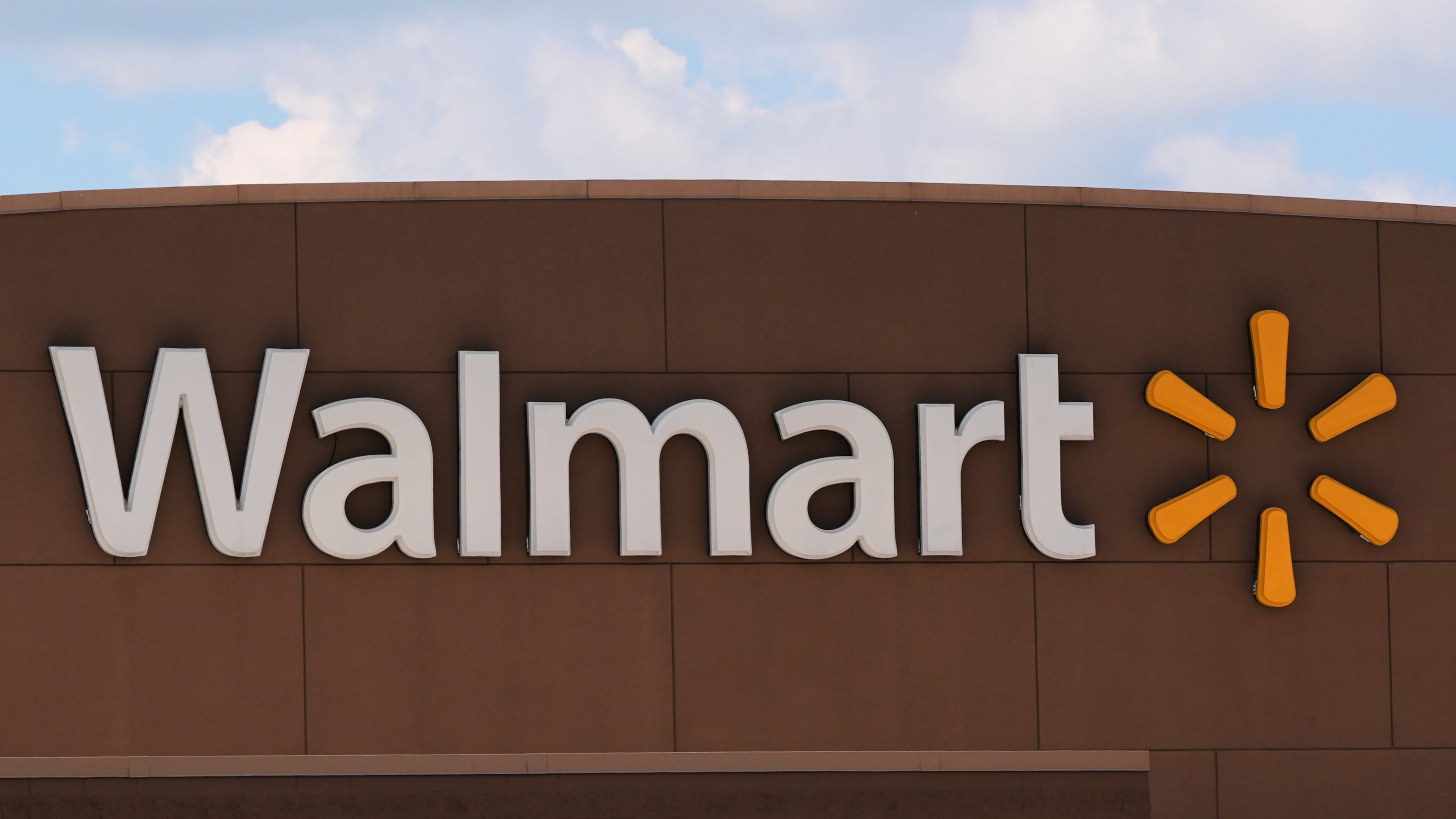 The Walmart logo is displayed on a store, Aug. 14, 2025, in Manchester, N.H. (AP Photo/Charles Krupa, File)
