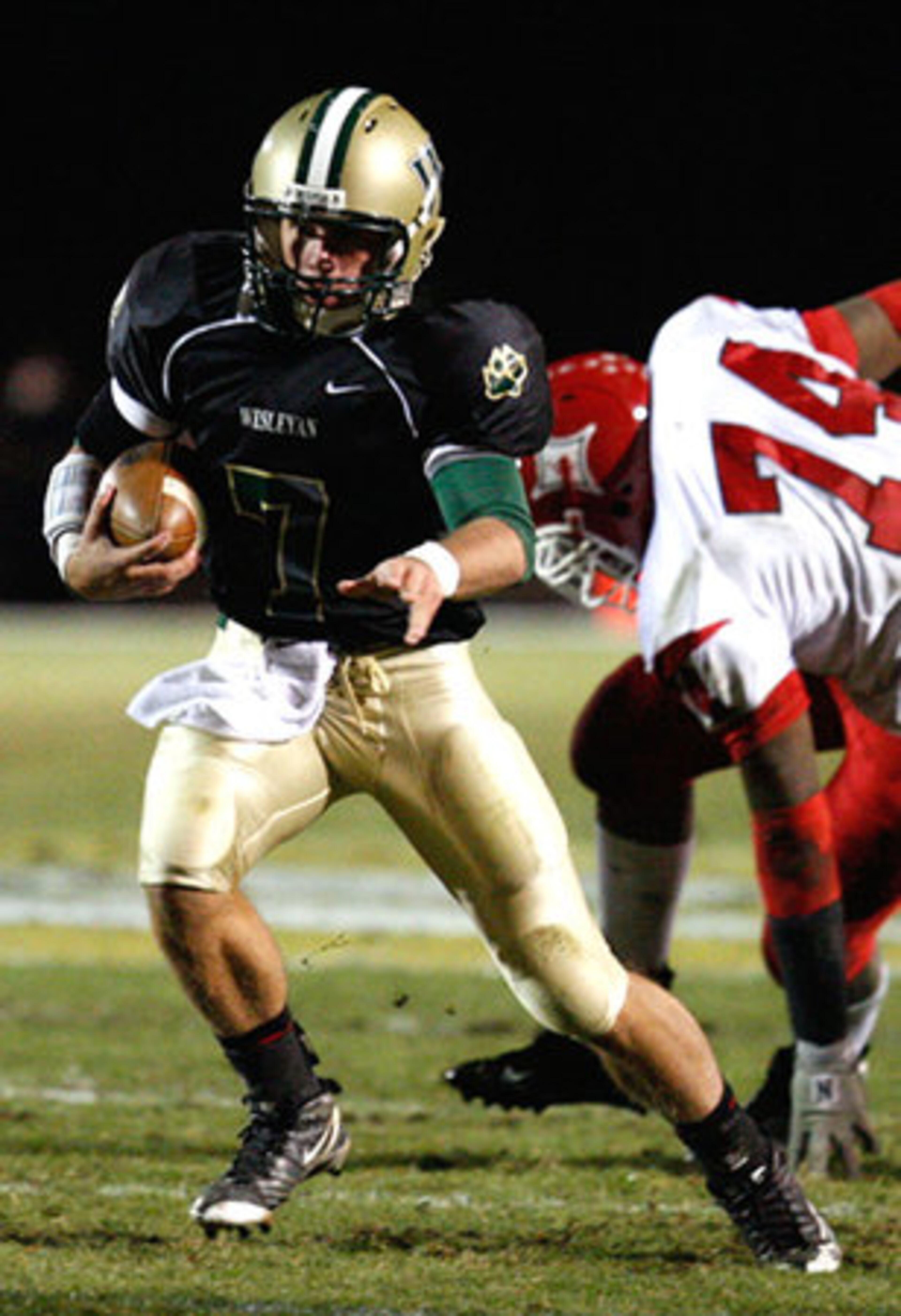 Wesleyan's Conor Welton (7) avoids Lincoln County's Marquila Parks (74).