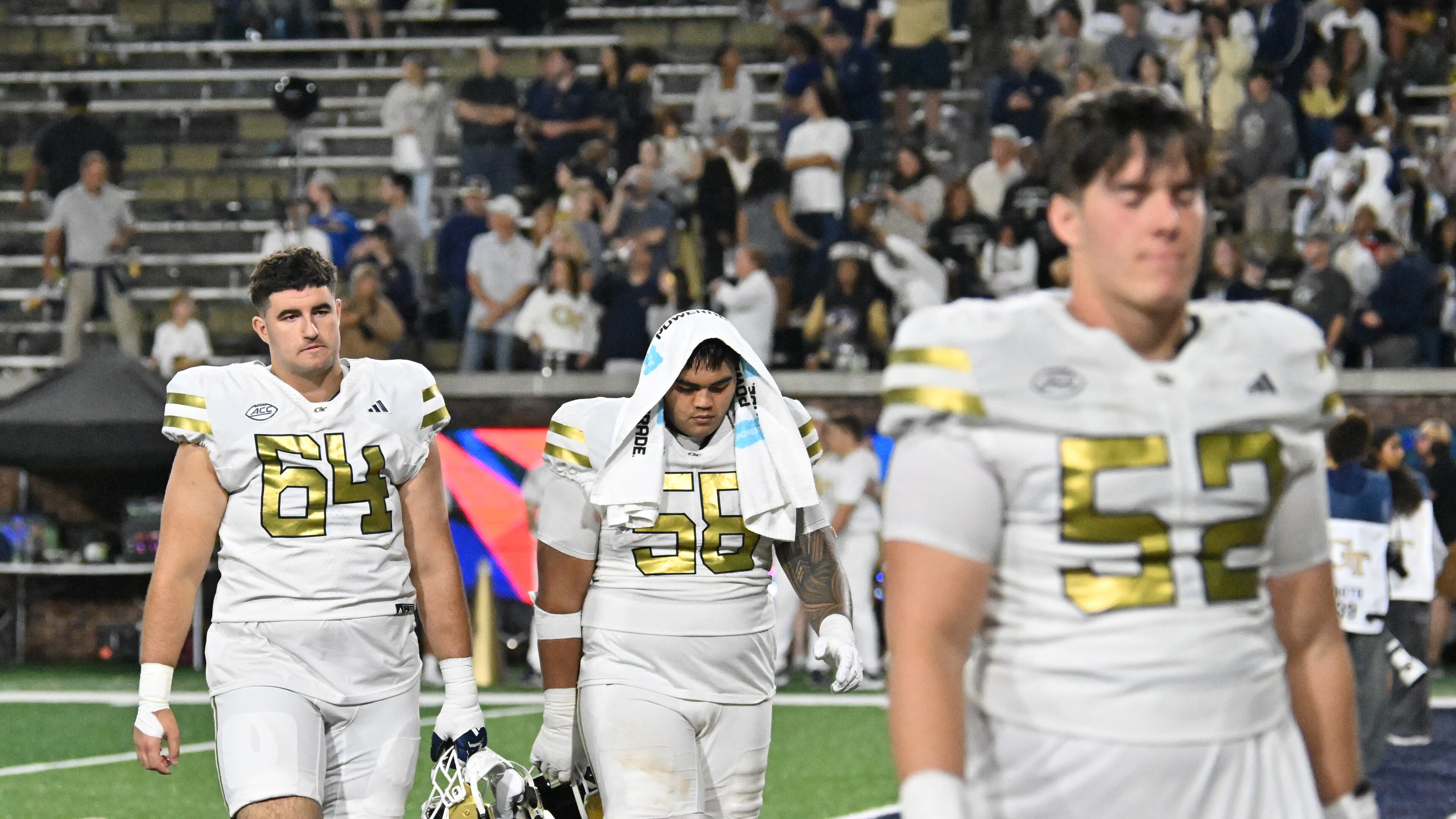 Georgia Tech players leave the field after Pittsburgh beat Georgia Tech during an NCAA college football game at Bobby Dodd Stadium, Saturday, November 22, 2025, in Atlanta. Pittsburgh won 42-28 over Georgia Tech. (Hyosub Shin/AJC)