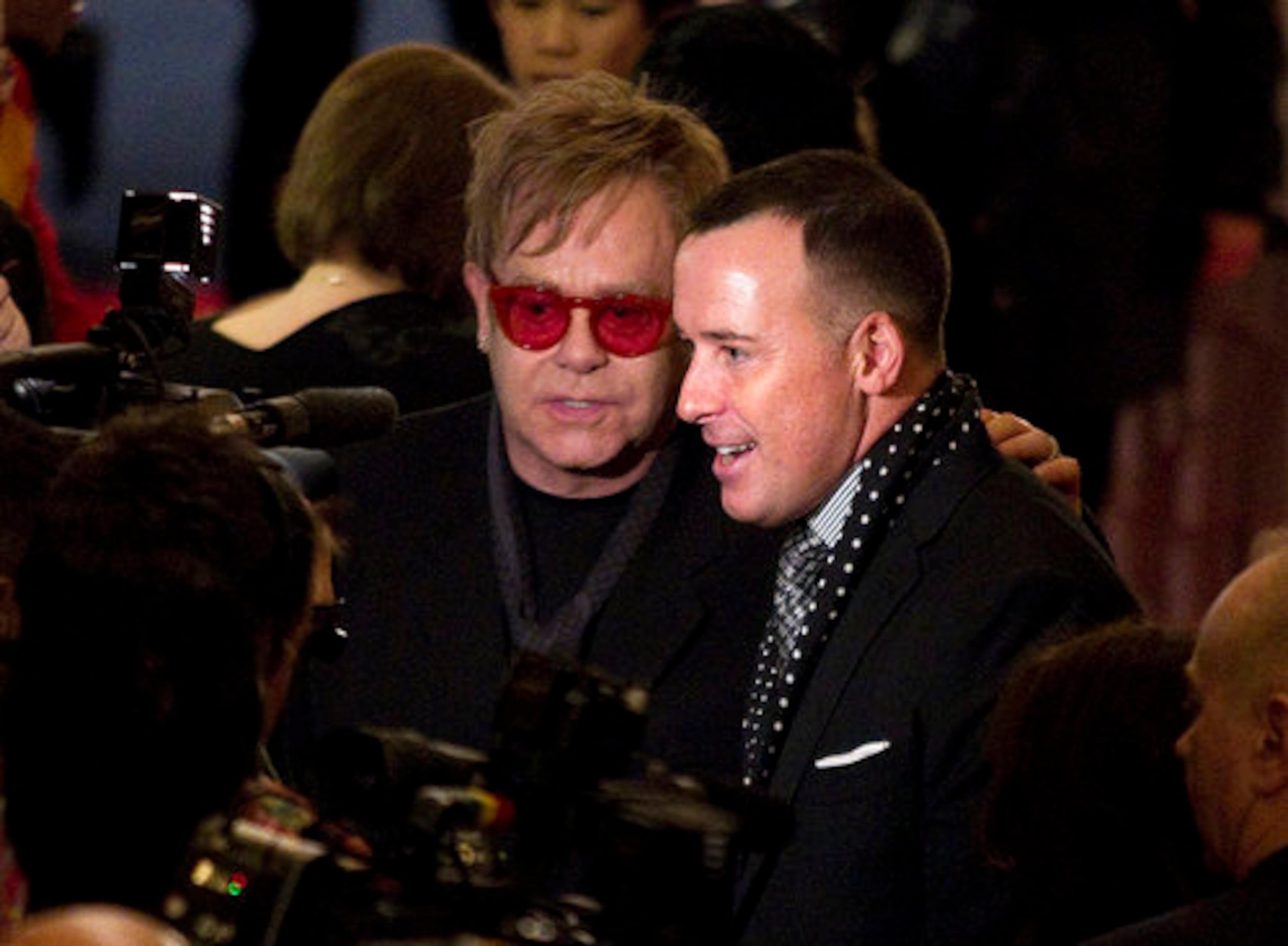 Sir Elton John and his partner, David Furnish, arrive Tuesday for the opening night of "Billy Elliot: The Musical" at Toronto's Canon Theatre. John wrote the music for the Tony Award-winning musical, while Furnish is an executive producer.