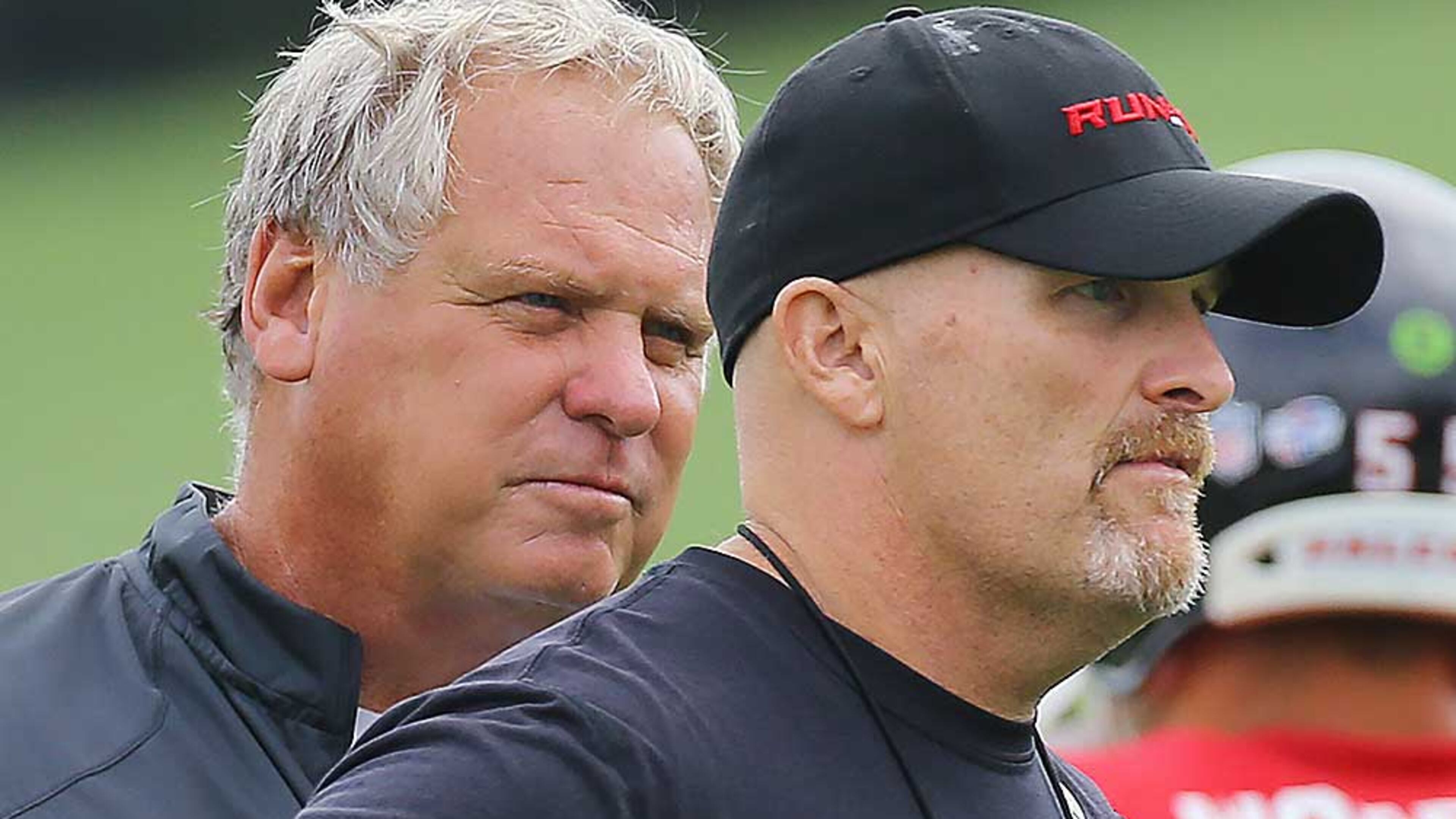 Falcons defensive coordinator Richard Smith (left) and coach Dan Quinn watch over team practice Tuesday, August, 18, 2015, in Flowery Branch. Curtis Compton / ccompton@ajc.com