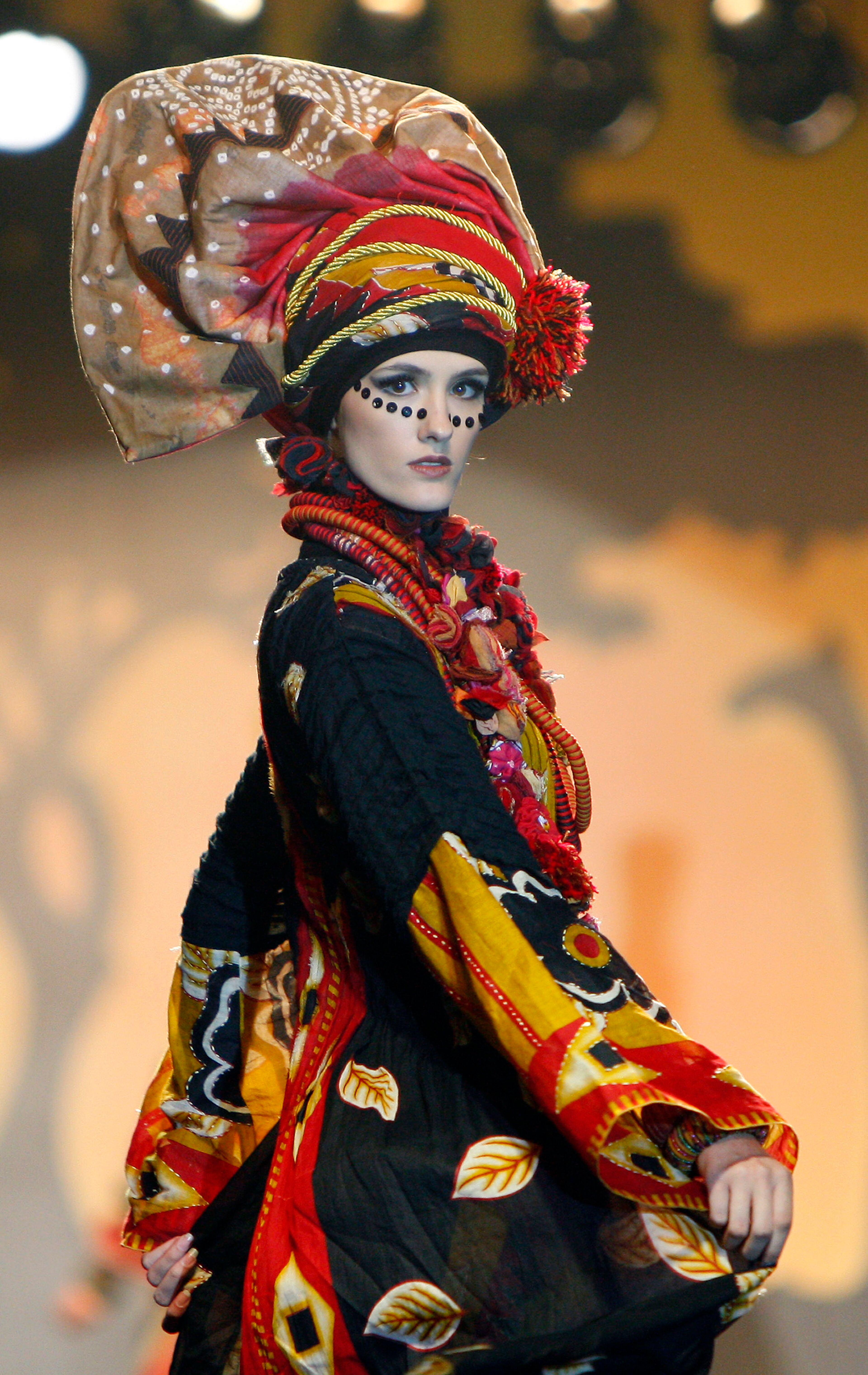 A model presents a creation by designer Paul Robb from Indonesia during the Islamic Fashion Festival in Kuala Lumpur, Malaysia, Monday, Nov. 5, 2012.