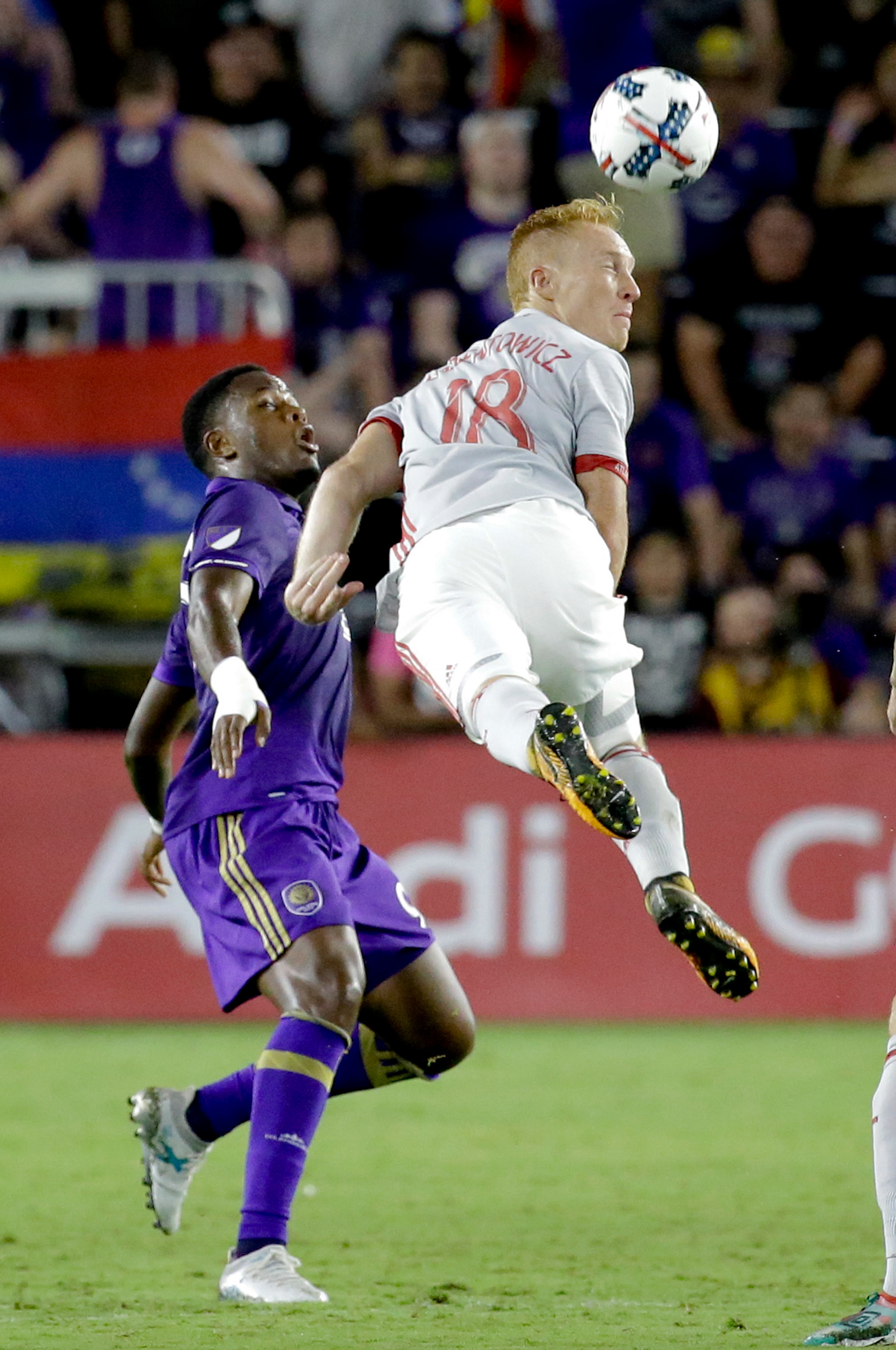Atlanta United's Jeff Larentowicz (18) gets position for a header in front of Orlando City's Cyle Larin, left, during the second half of an MLS soccer match, Friday, July 21, 2017, in Orlando, Fla. Atlanta United won 1-0. (AP Photo/John Raoux)