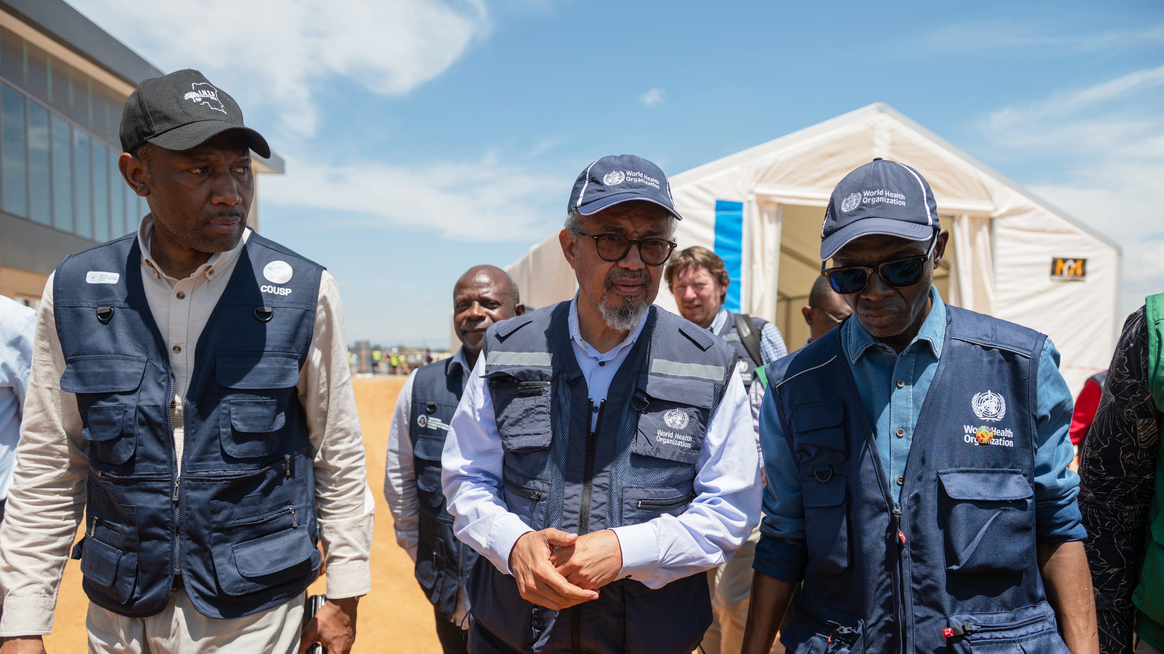 Director General of the World Health Organisation (WHO), Tedros Adhanom Ghebreyesus, center, arrives in Bunia, Congo, Saturday, May 30, 2026. (AP Photo/Moses Sawasawa)