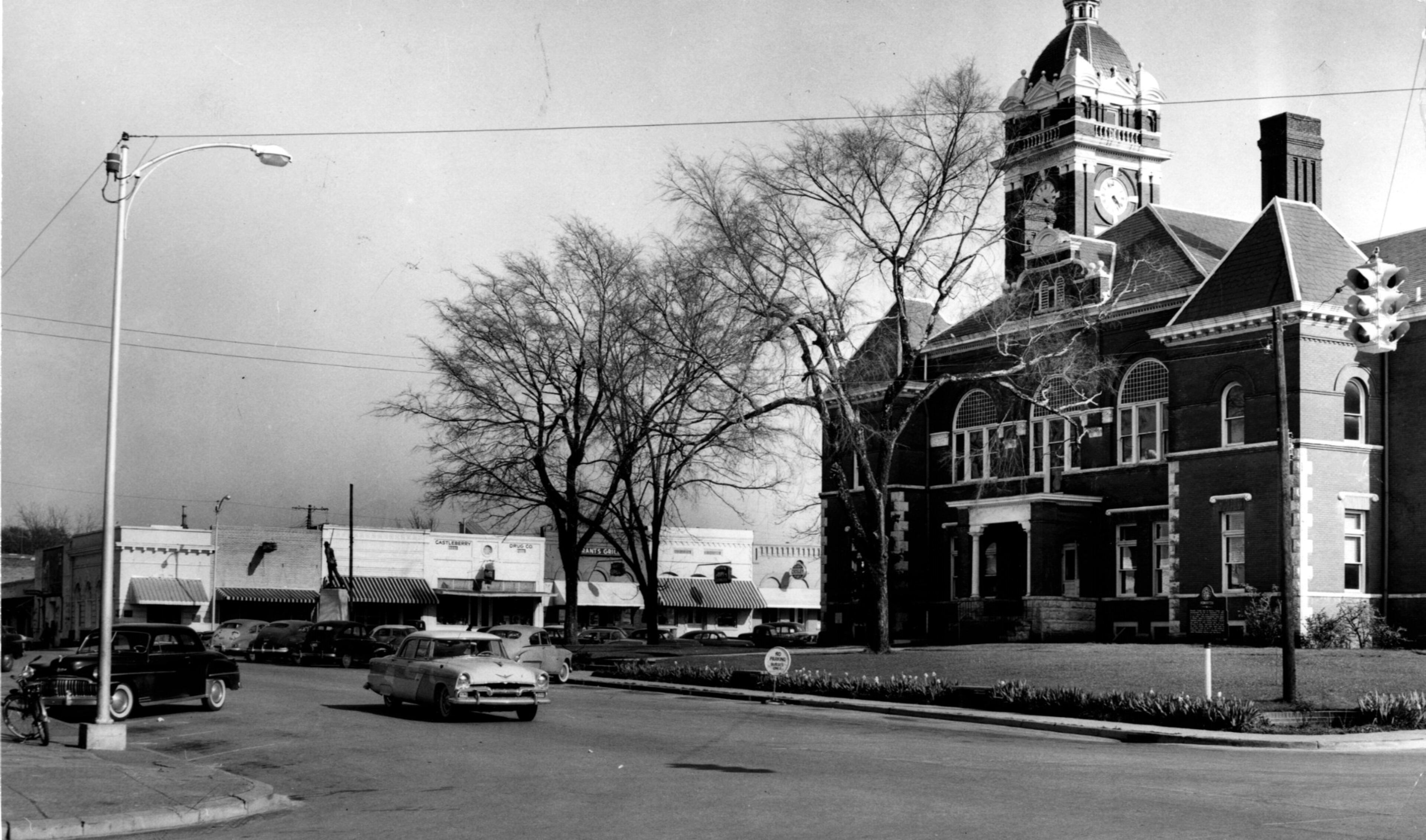 Forsyth's Courthouse Square, beside which Route 41 runs at present. At, first, citizens balked at idea of losing their 'through-town' highway. (1957)
