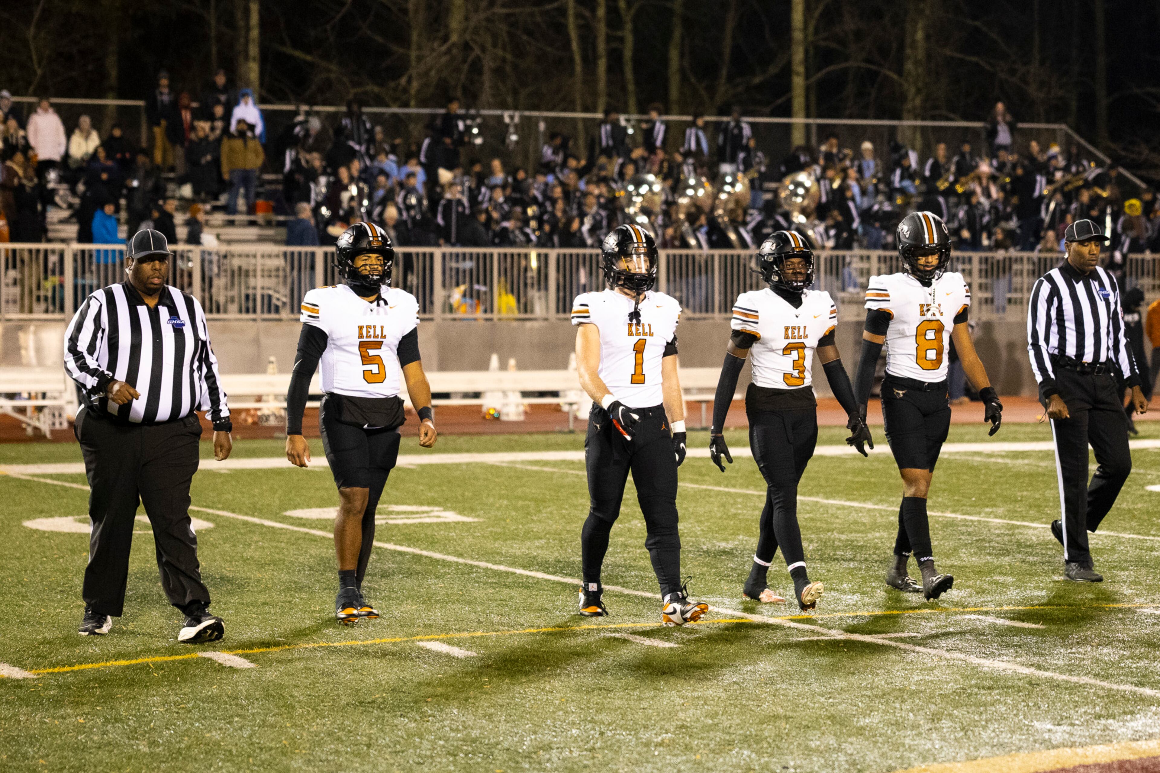 Kell captains come up to the center circle before their Class 4A semifinal against Creekside on Friday, Dec. 5, 2025, at Creekside High School in Fairburn. (Oscar Guevara Saenz for the AJC)