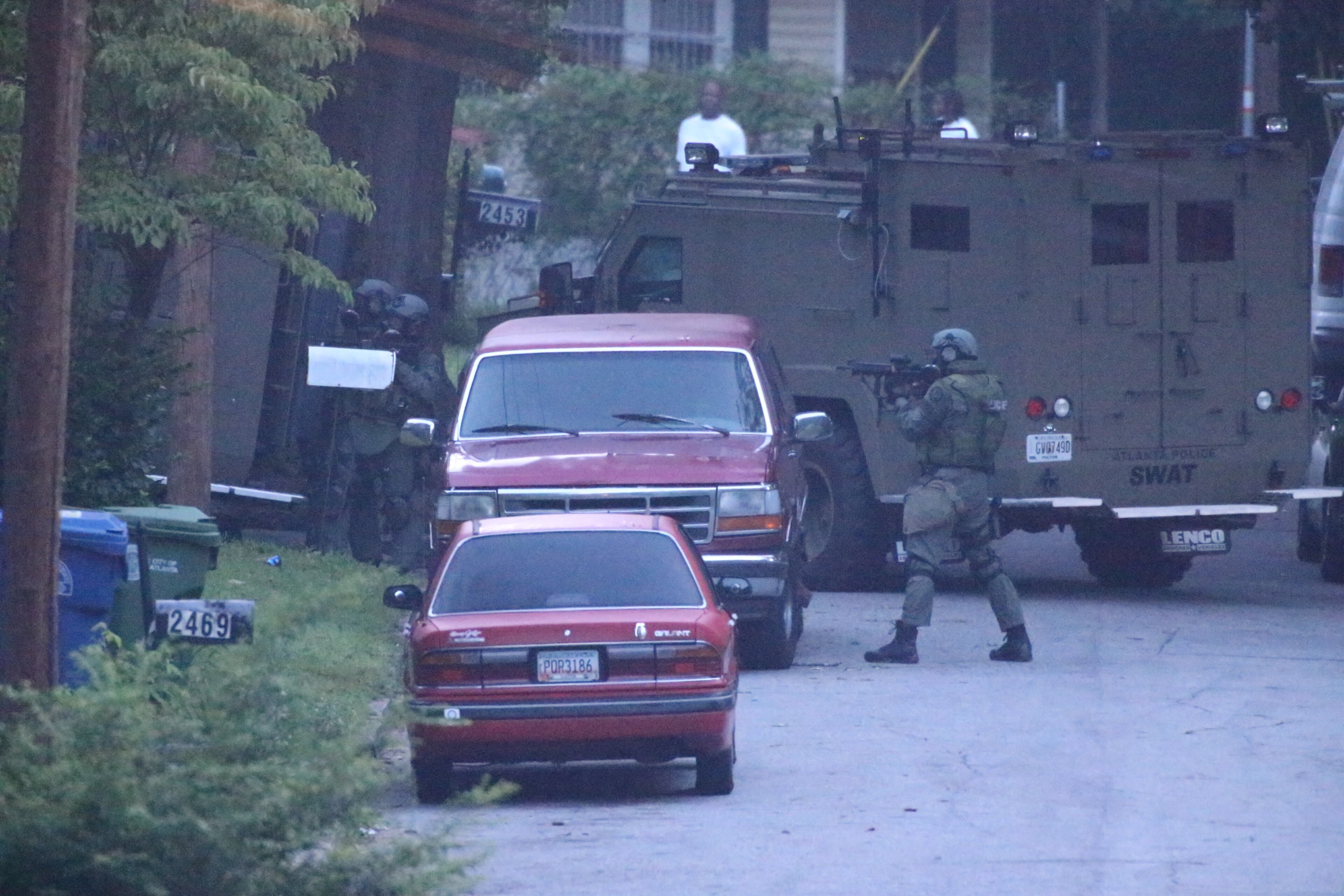The incident began around 1:30 a.m. with reports of a man pulling a gun on a woman at a home in the 2400 block of Baxter Street. JOHN SPINK/JOHNSPINK@AJC.COM