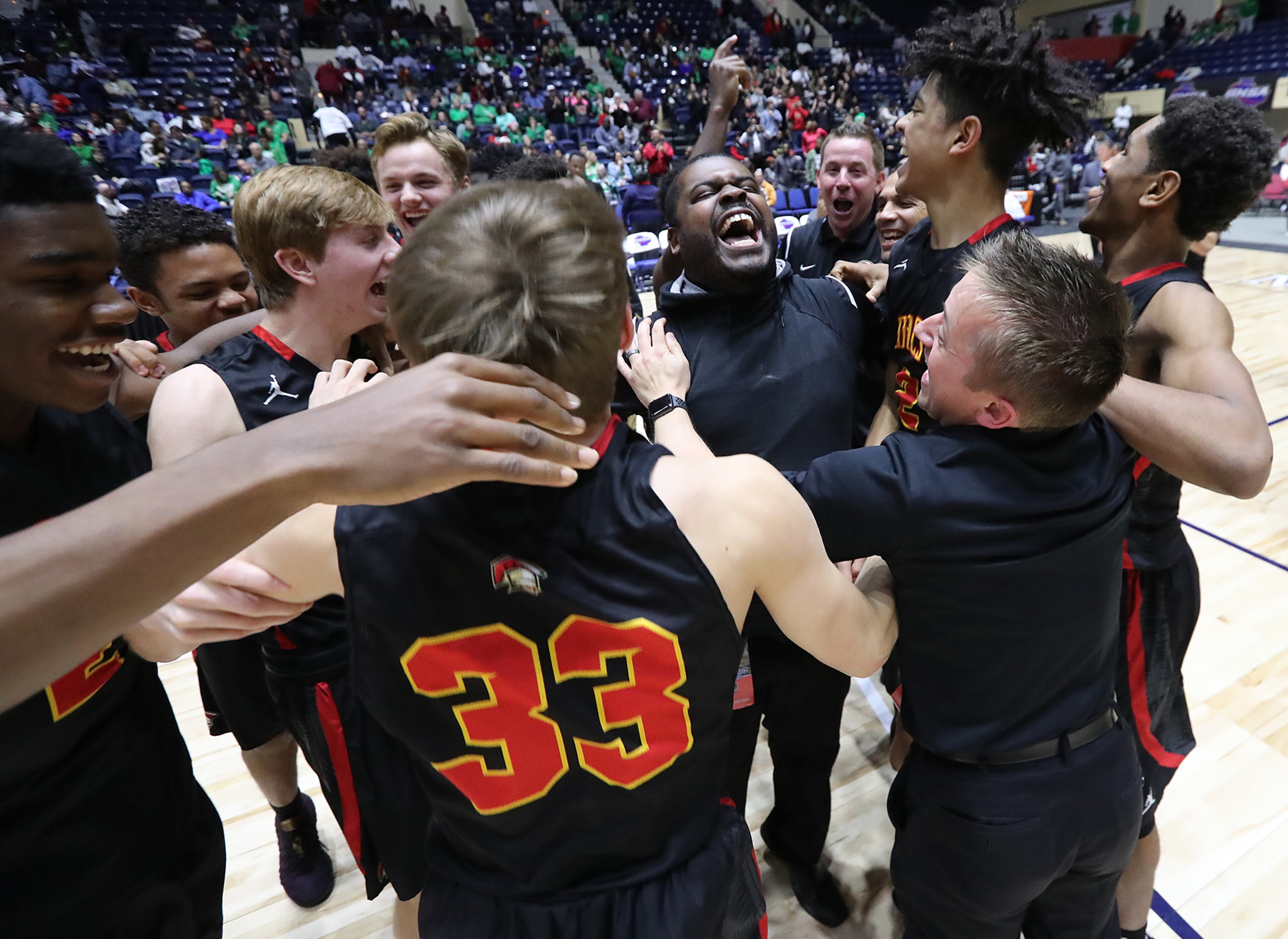 March 8, 2018 Macon: GAC celebrates beating Jenkins 67-53 in their GHSA state basketball championship game on Thursday, March 8, 2018, in Macon. Curtis Compton/ccompton@ajc.com