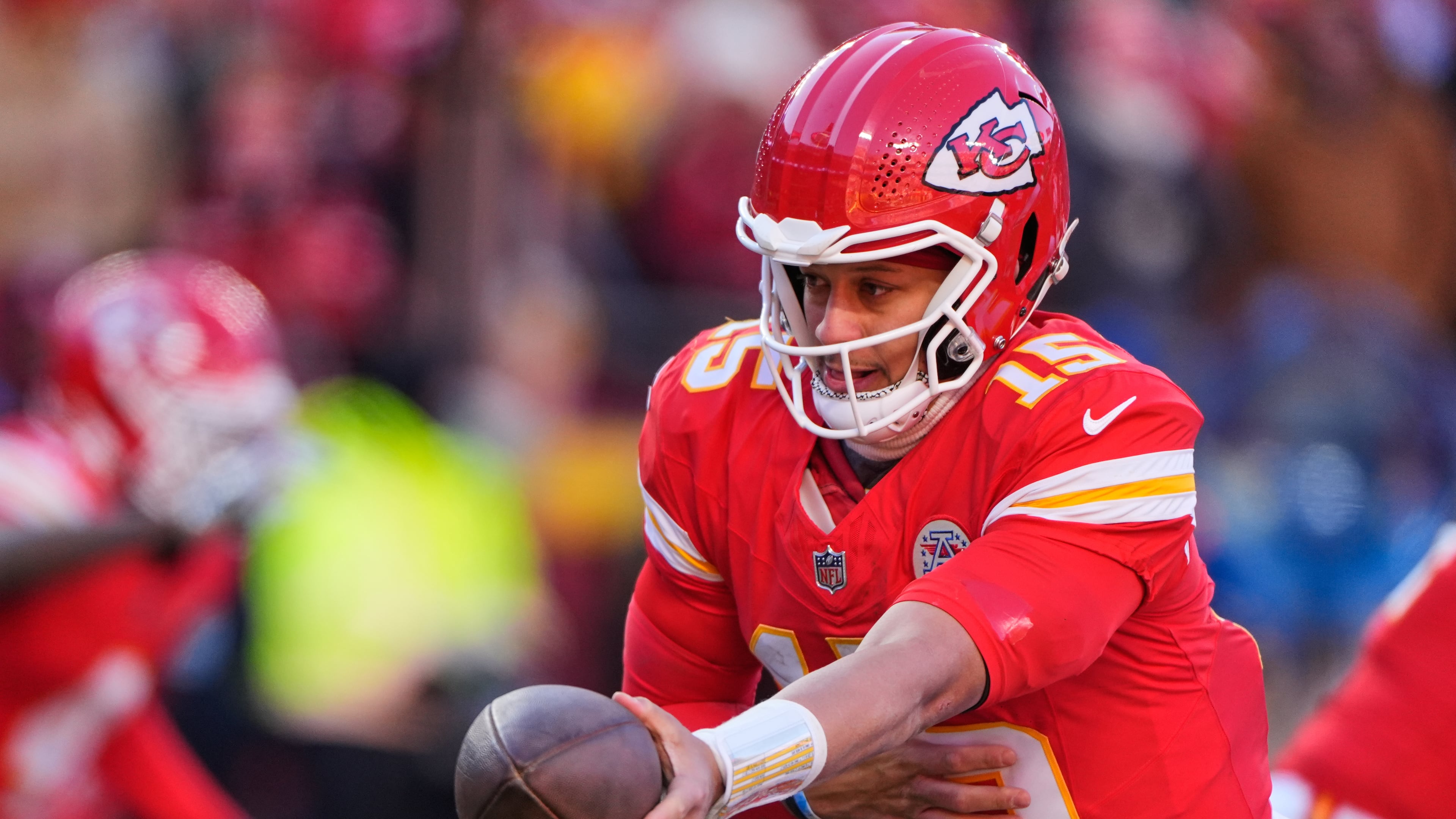 FILE - Kansas City Chiefs quarterback Patrick Mahomes hands off the ball during the second half of an NFL football game against the Los Angeles Chargers, Dec. 14, 2025, in Kansas City, Mo. (AP Photo/Charlie Riedel, File)