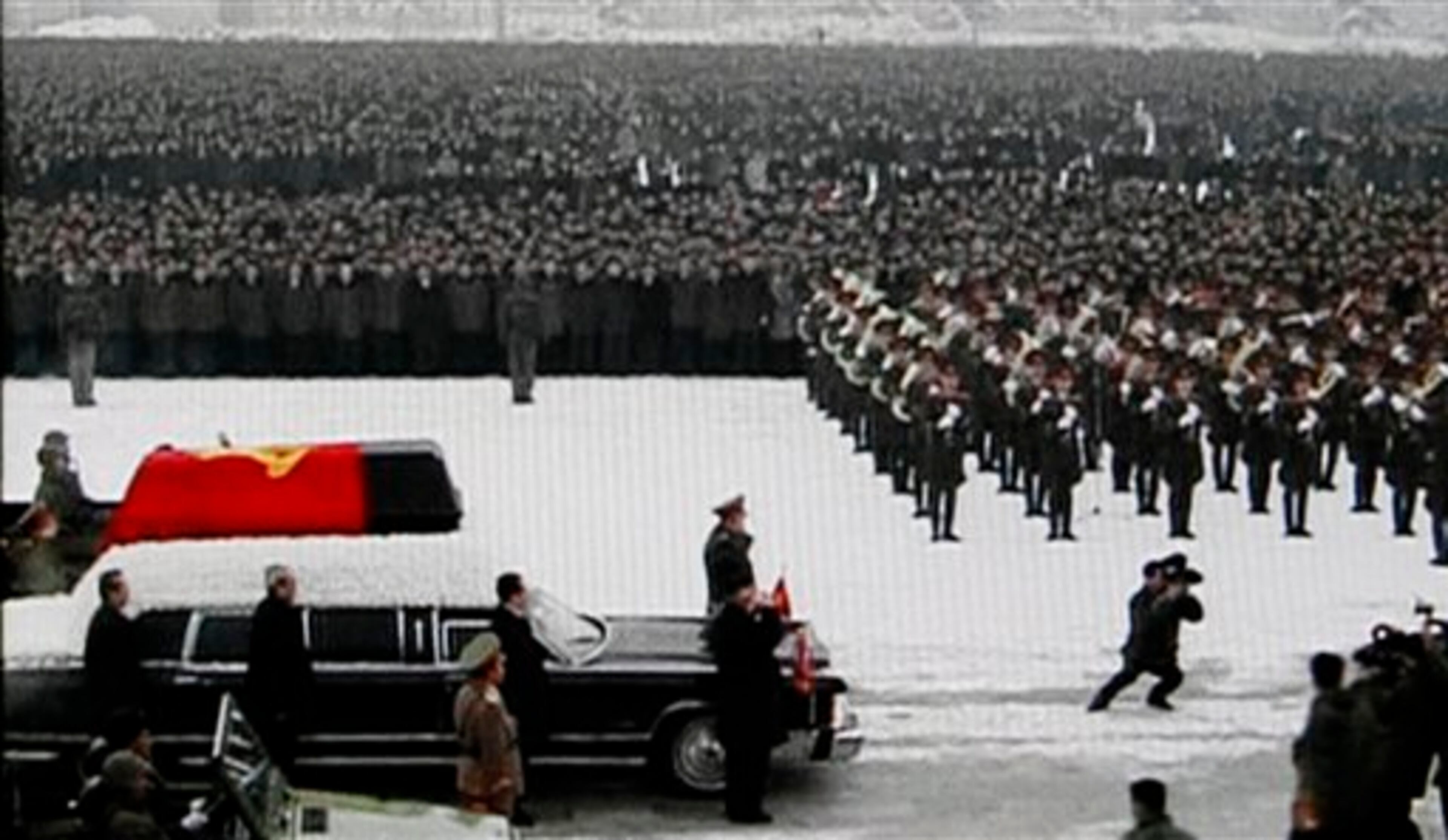 In this image made from KRT video, Kim Jong Un, bottom center, Kim Jong Il's youngest son and successor, walks next to his father's hearse during a funeral procession for the late North Korean leader, in Pyongyang, North Korea Wednesday, Dec. 28, 2011. (AP Photo/KRT via APTN)