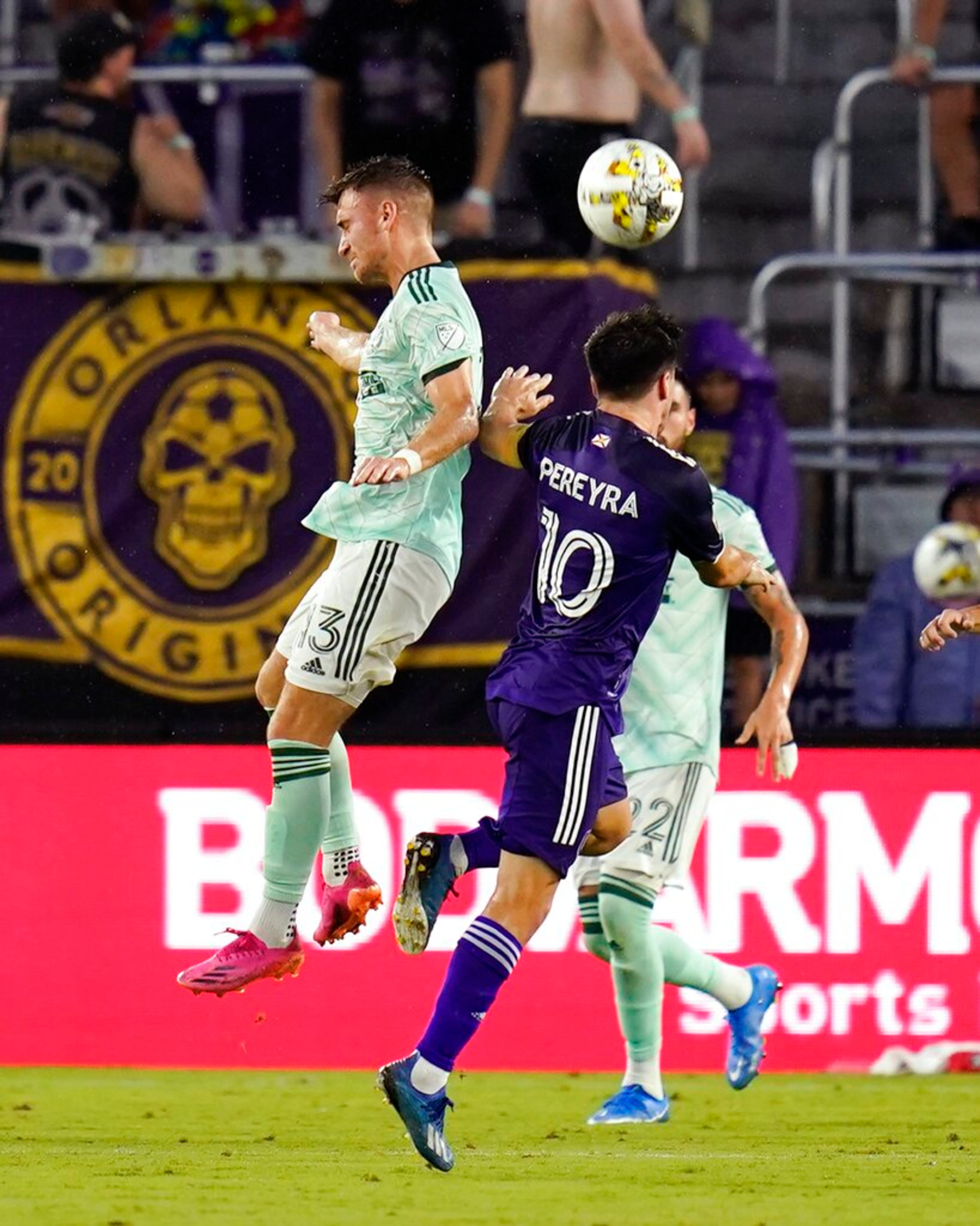 Atlanta United's Amar Sejdic (13) and Orlando City's Mauricio Pereyra (10) go up for a head ball during the first half of an MLS soccer match Wednesday, Sept. 14, 2022, in Orlando, Fla. (AP Photo/John Raoux)