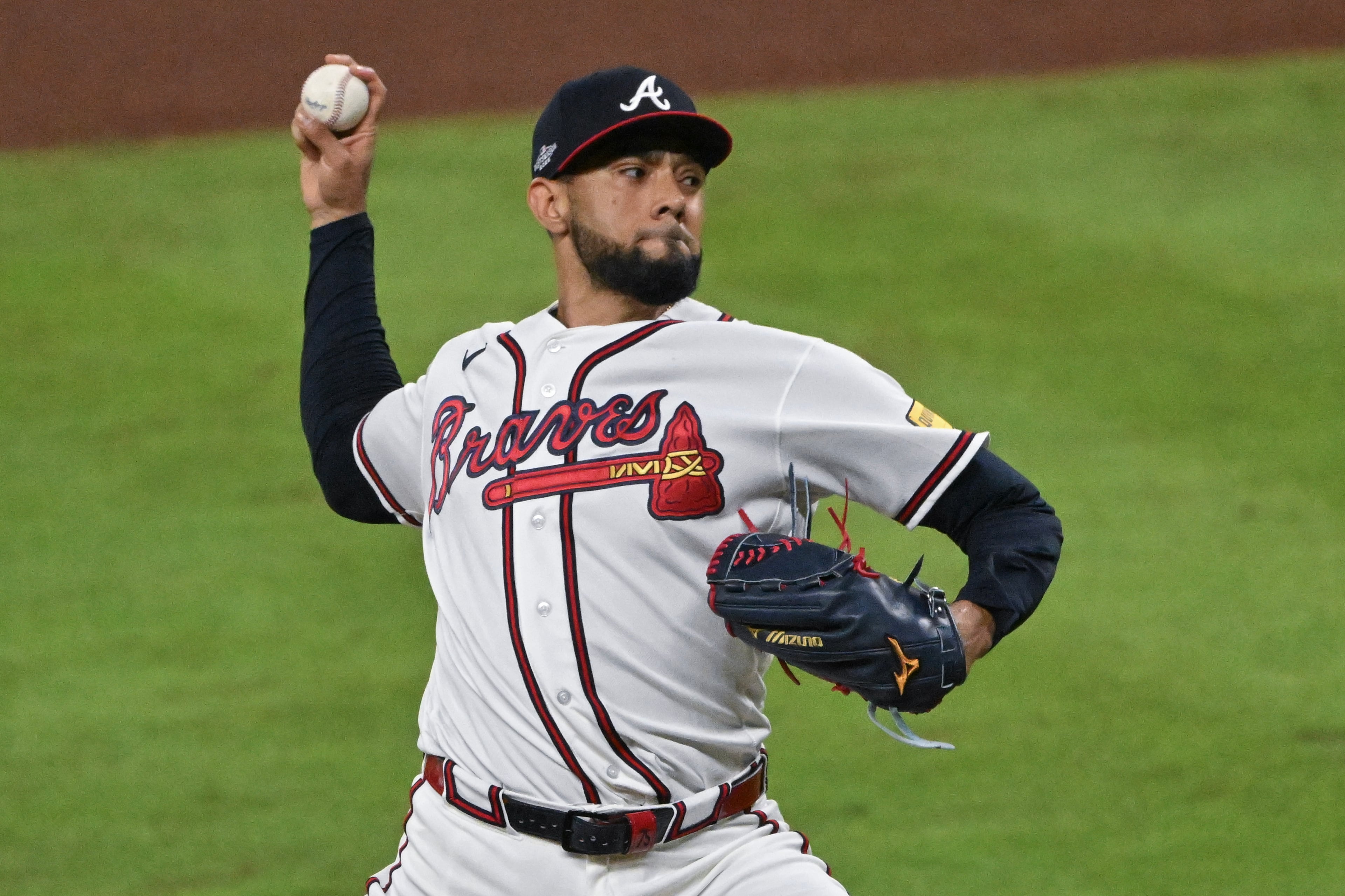 Atlanta Braves pitcher Robert Suarez (75) delivers to a Los Angeles Dodgers batter during the seventh inning of Game 4 of the MLB National League Division Series between the Atlanta Braves and the Los Angeles Dodgers, Wednesday, Oct. 7, 2026, in Atlanta. (Hyosub Shin/AJC)