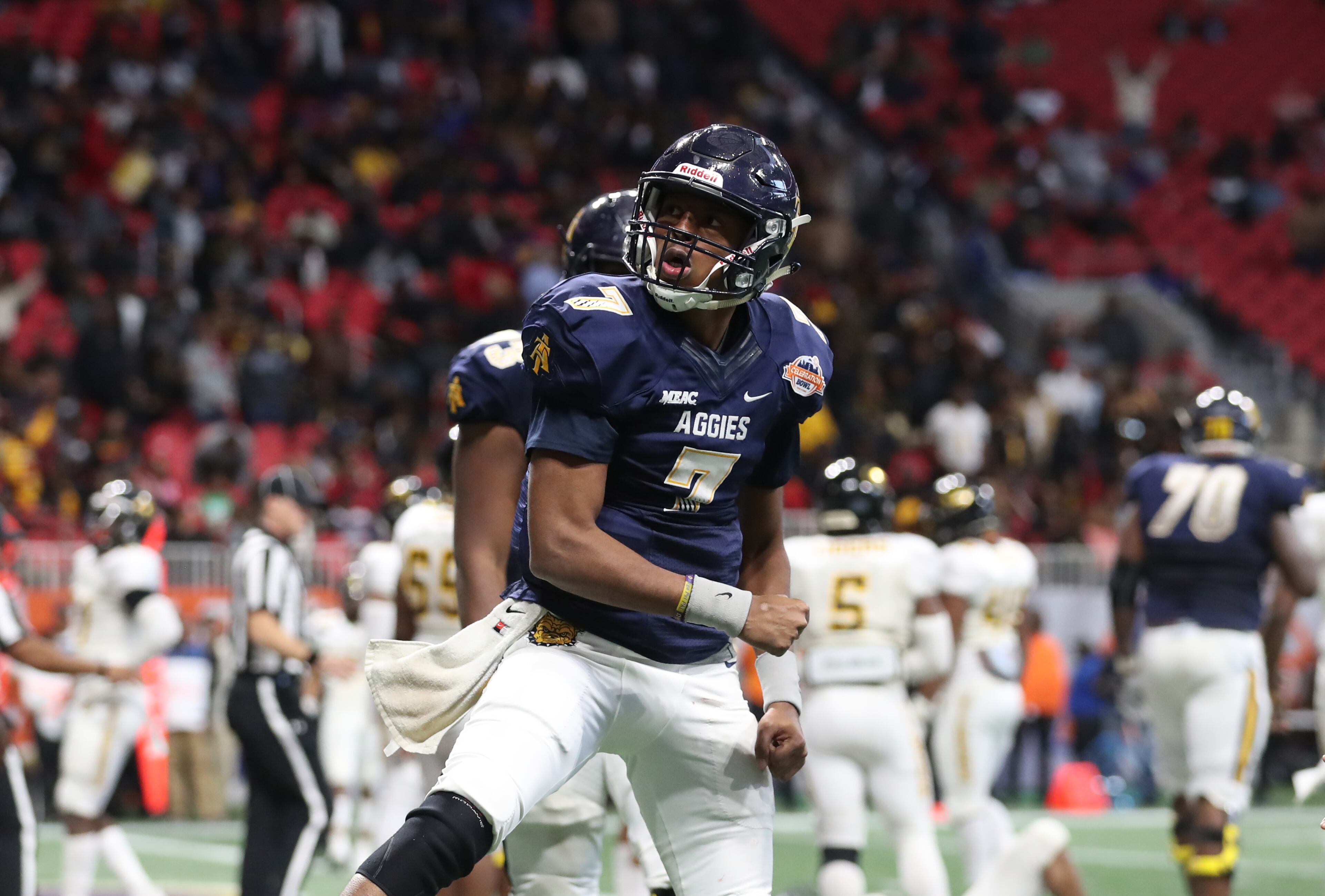 December 16, 2017 - Atlanta, Ga: North Carolina A&T Aggies quarterback Lamar Raynard (7) celebrates his rushing touchdown in the second half against the Grambling State Tigers during the Celebration Bowl football game at Mercedes-Benz Stadium Saturday, December 16, 2017, in Atlanta. North Carolina A&T Aggies won 21-14. PHOTO / JASON GETZ