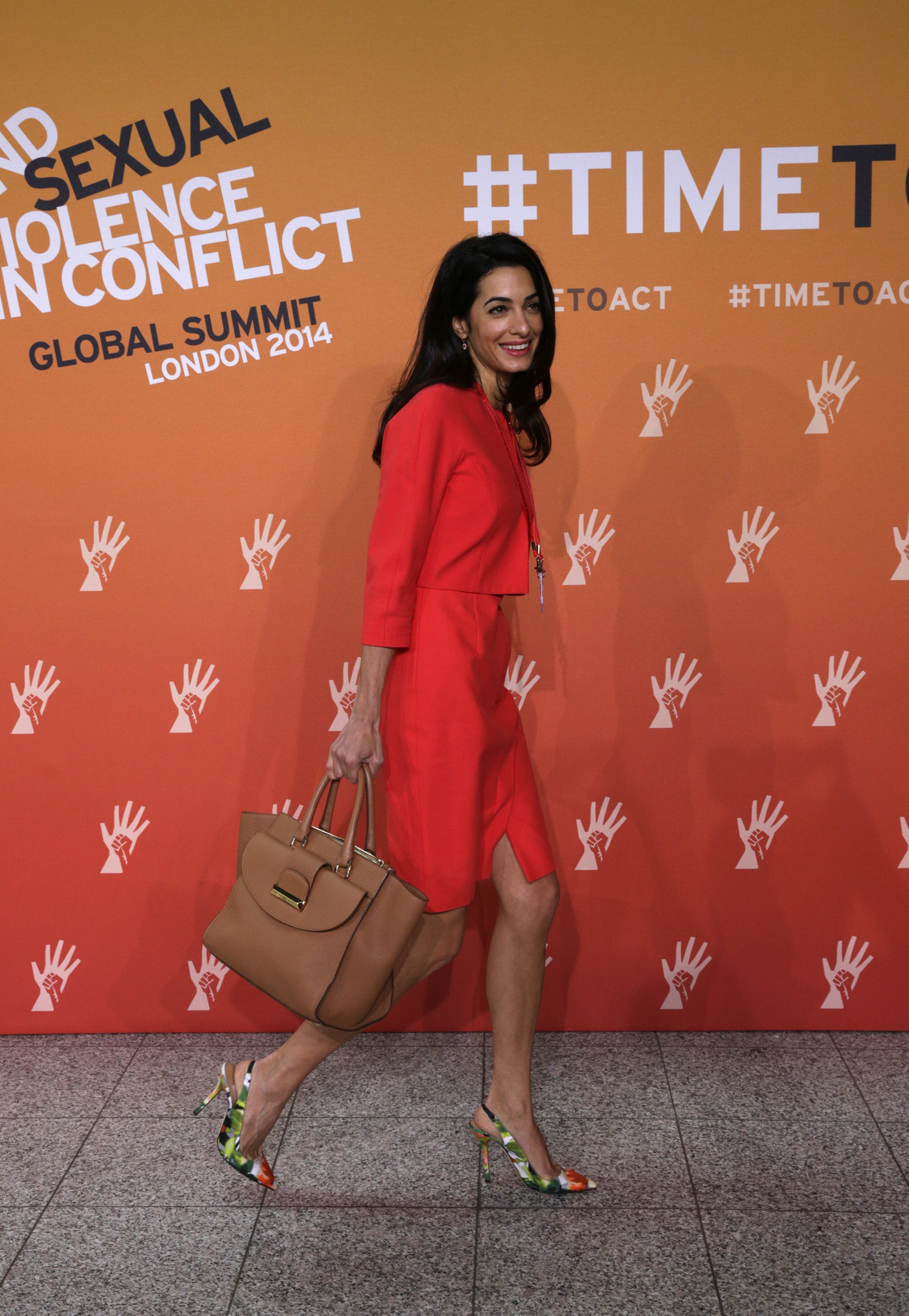 Amal Alamuddin, human rights lawyer and fiancee of US actor George Clooney attends the 'End Sexual Violence in Conflict' summit in London, Thursday, June 12, 2014. The Summit welcomes governments from over 100 countries, over 900 experts, NGOs, Faith leaders, and representatives from international organizations across the world. (AP Photo/Lefteris Pitarakis)