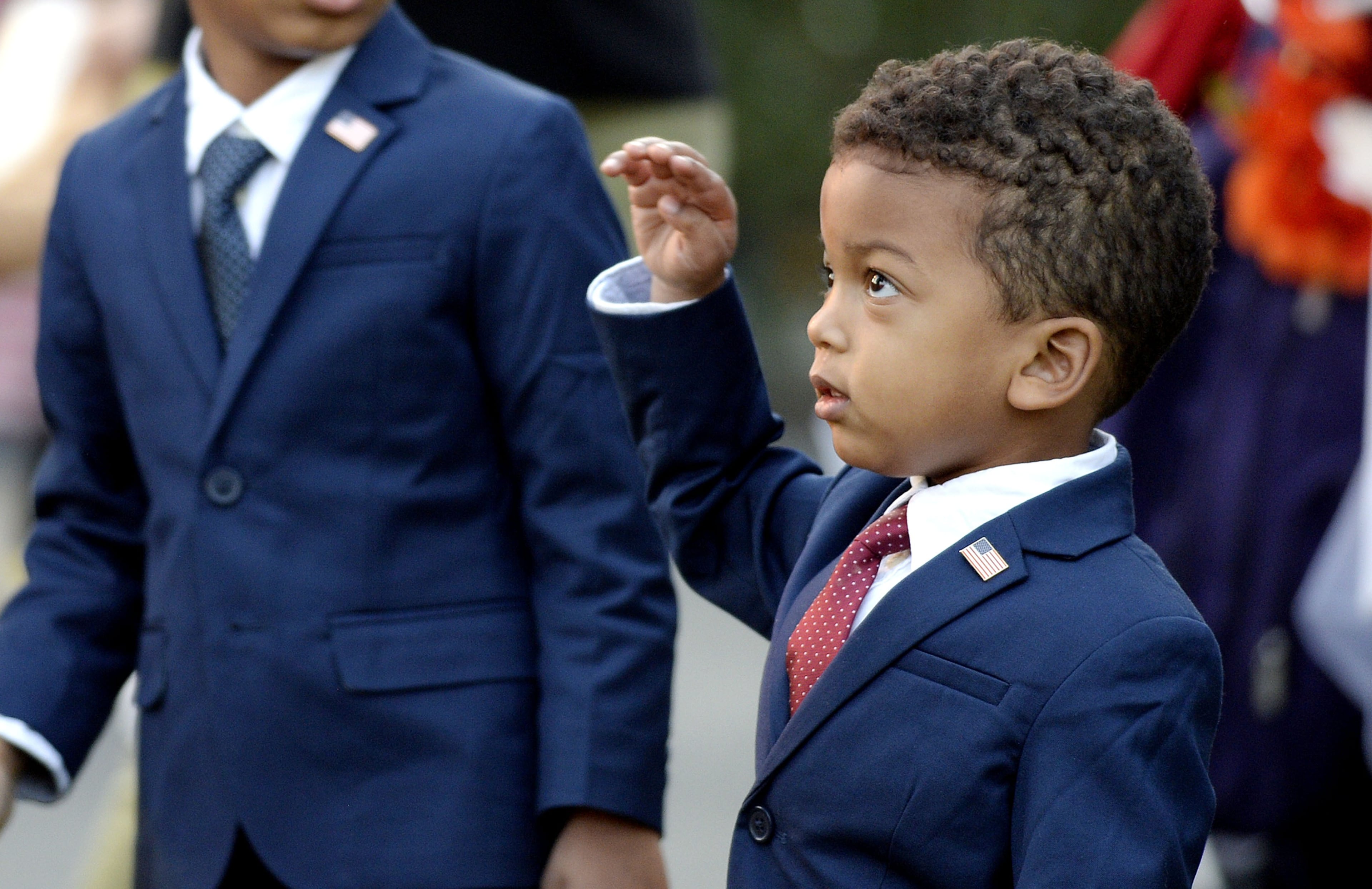 WASHINGTON, DC - OCTOBER 31: A child dressed up as President Barack Obama looks on during a Halloween event at the South Lawn of the White House October 31, 2016 in Washington, DC. The first couple hosted local children and children of military families for trick-or-treating at the White House. (Photo by Olivier Douliery-Pool/Getty Images)