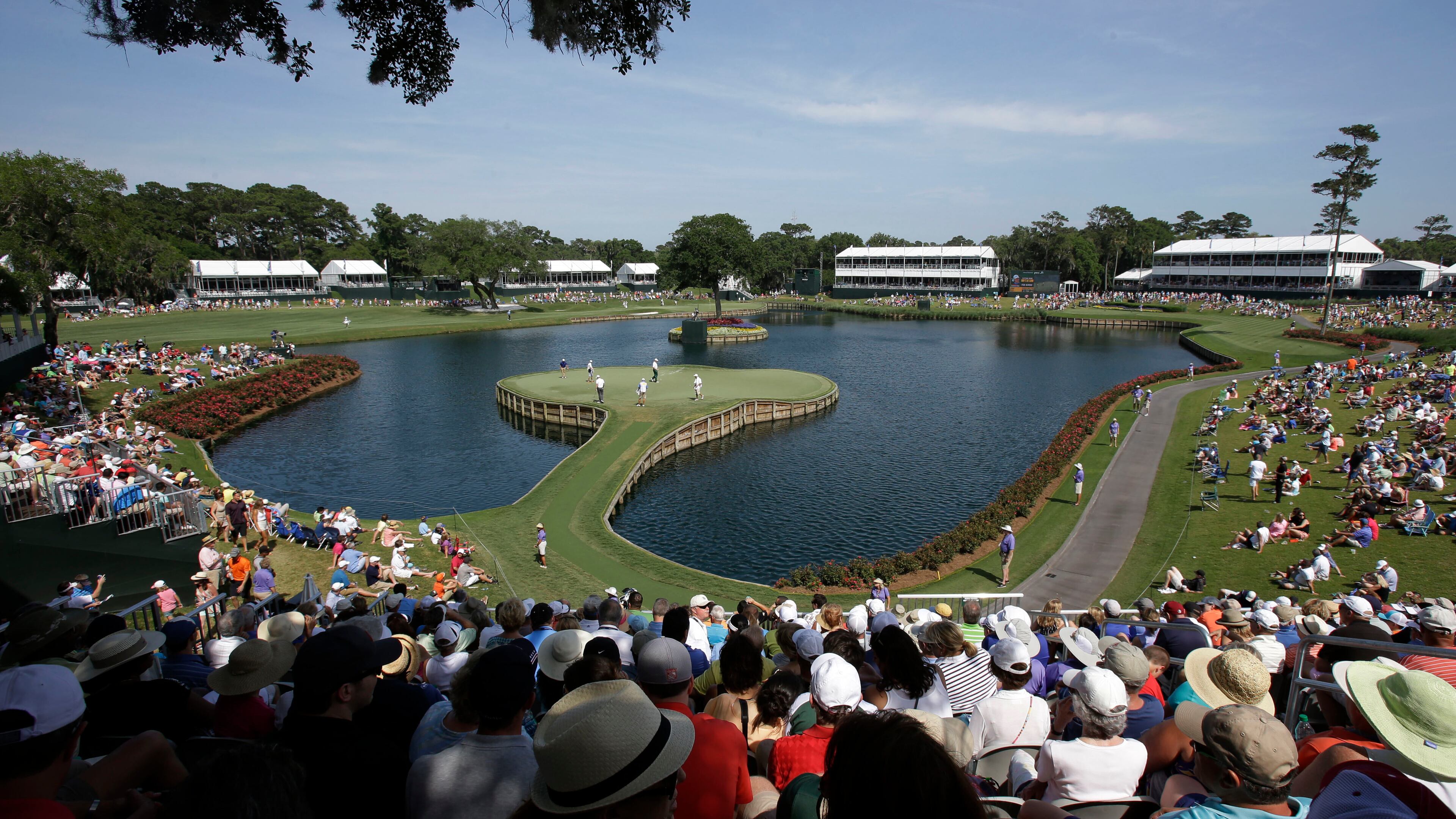 FILE -Golfers play the 17th hole during the second round of The Players championship golf tournament at TPC Sawgrass, May 9, 2014, in Ponte Vedra Beach, Fla. (AP Photo/John Raoux, File)