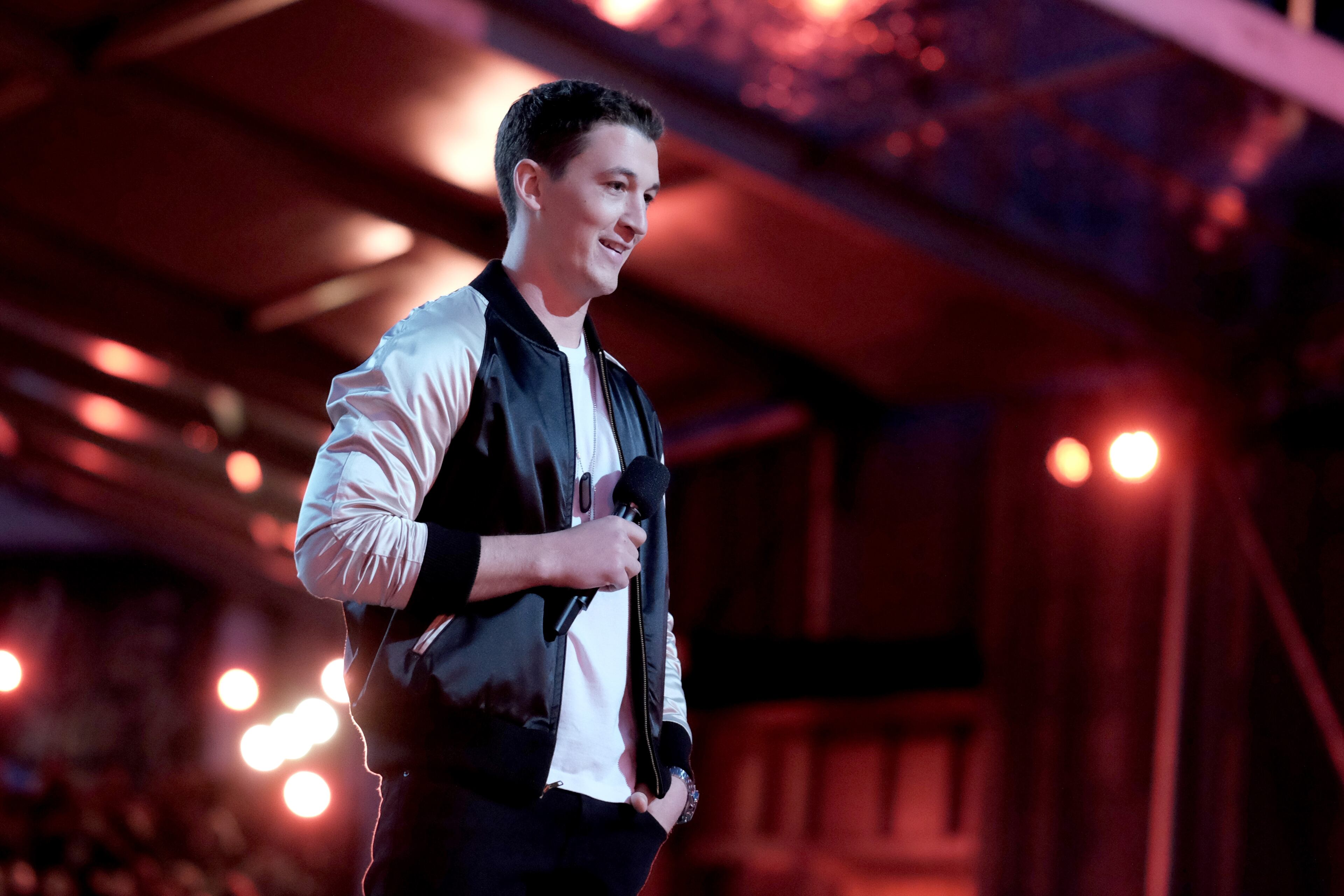 BURBANK, CALIFORNIA - APRIL 09: Actor Miles Teller speaks onstage during the 2016 MTV Movie Awards at Warner Bros. Studios on April 9, 2016 in Burbank, California. MTV Movie Awards airs April 10, 2016 at 8pm ET/PT. (Photo by Jason Kempin/Getty Images for MTV)
