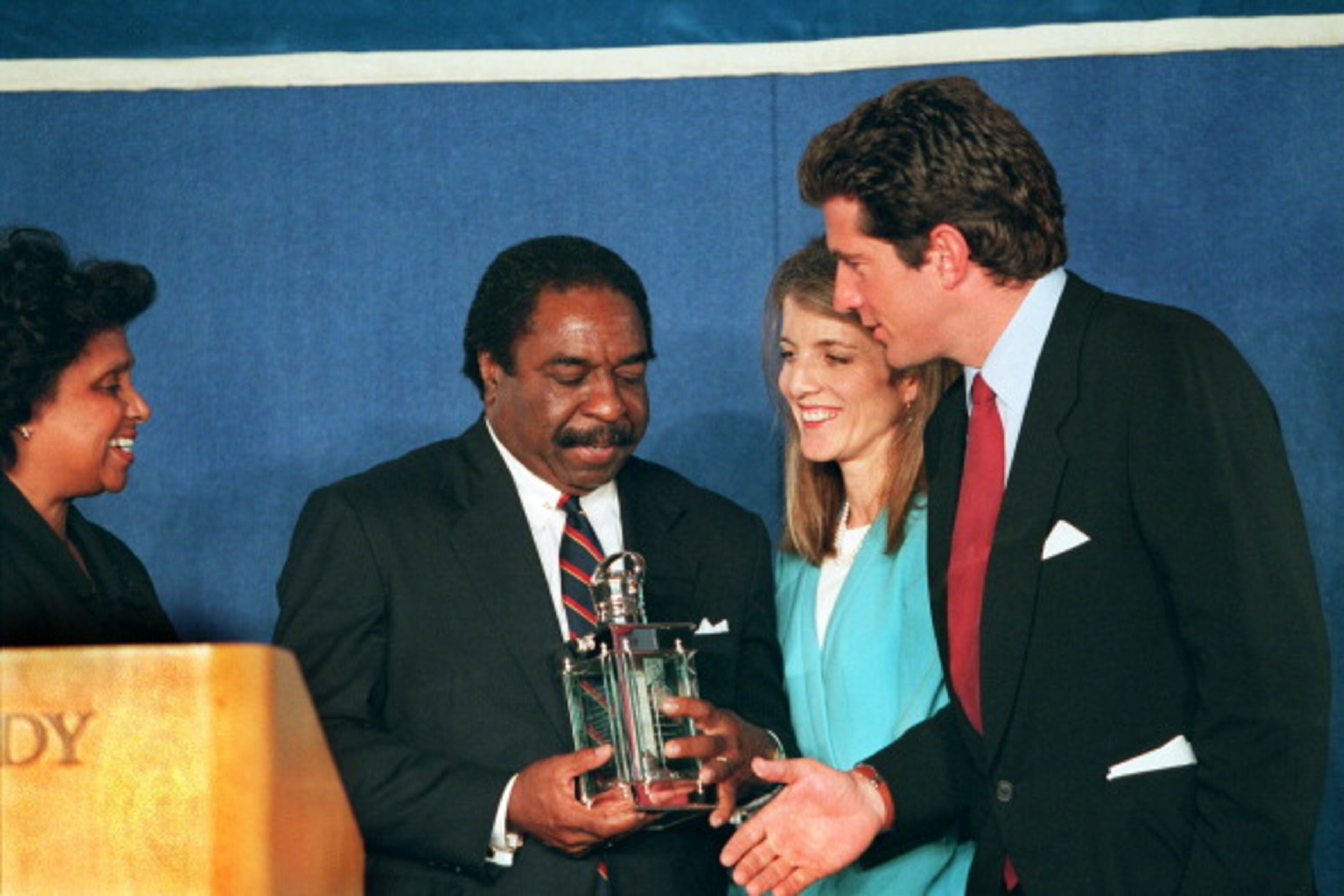 DORCHESTER - MAY 29: From left to right: Judge Charles Pierce receives this year's Profile In Courage award from Caroline Kennedy and John Kennedy, Jr. during today's ceremony at the JFK Library. (Photo by Barry Chin/The Boston Globe via Getty Images)