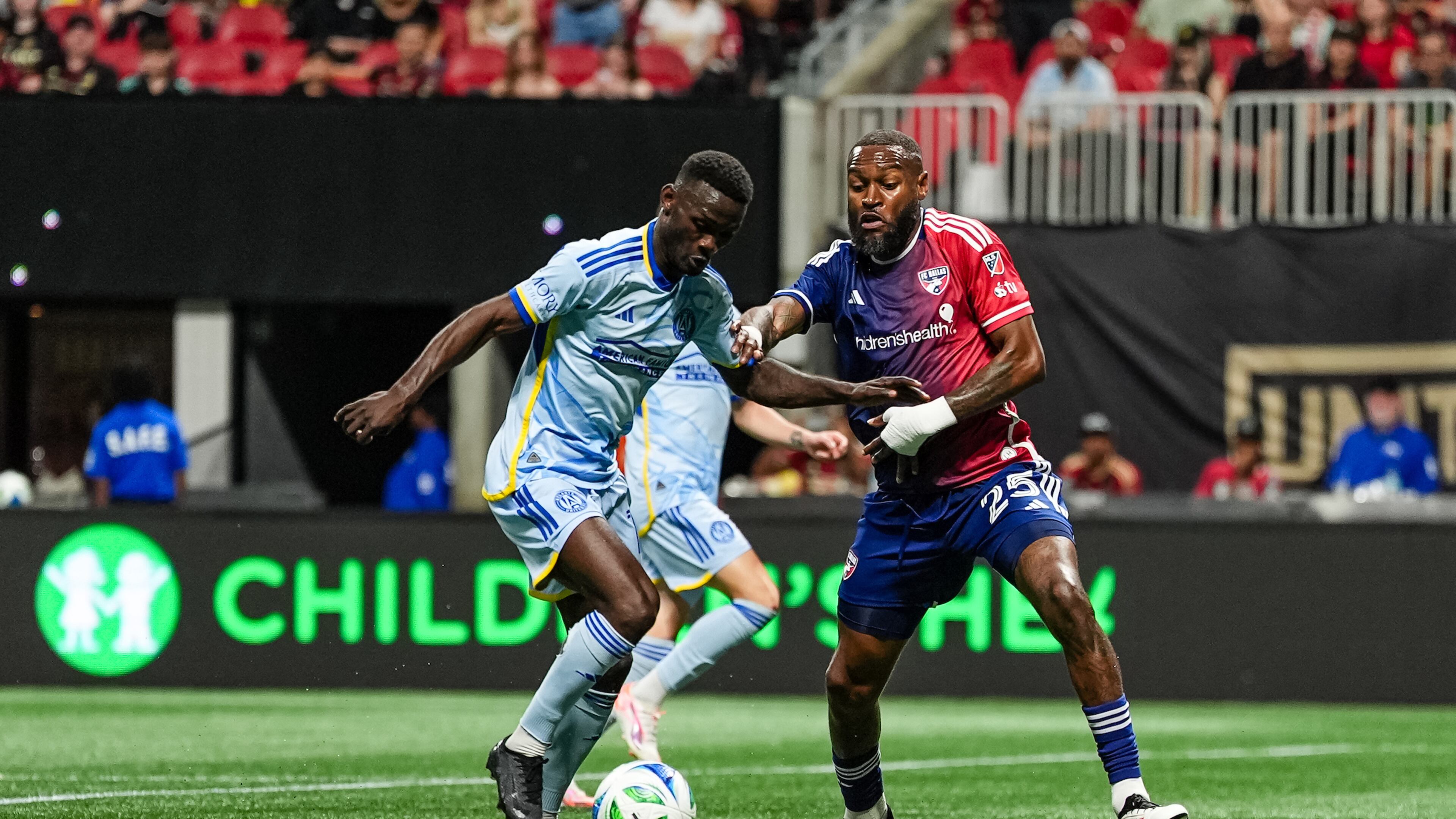Atlanta United forward Emmanuel Latte Lath (left) dribbles during the match against FC Dallas at Mercedes-Benz Stadium in Atlanta on Saturday, April 5, 2025. (Photo by Mitch Martin / Atlanta United)