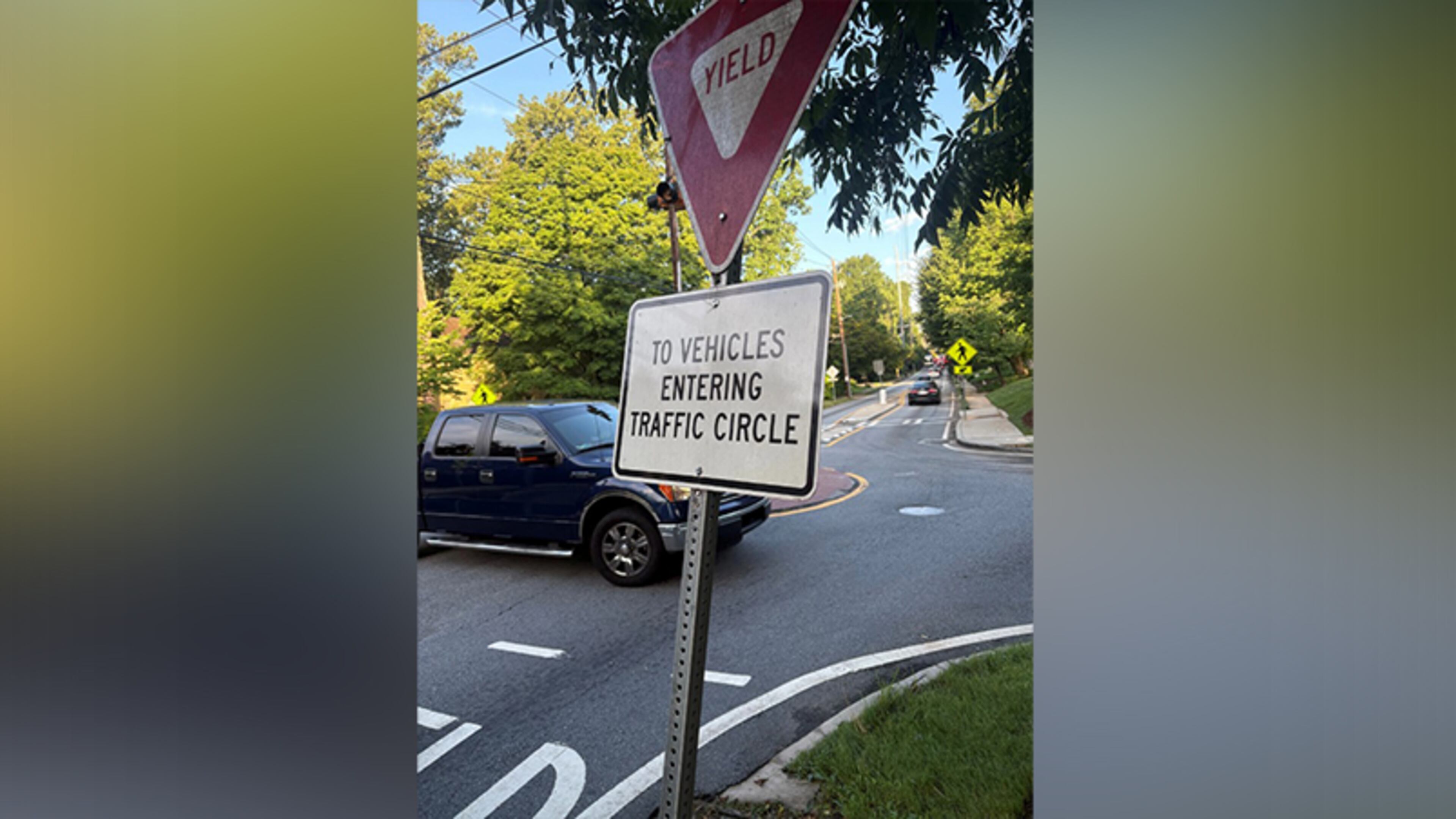 Druid Hills resident Don Jennings spotted signs in roundabouts on North Decatur Road at Oakdale and at Springdale that told drivers to violate Georgia law. DeKalb County ended up removing the signs. (Courtesy of Don Jennings)