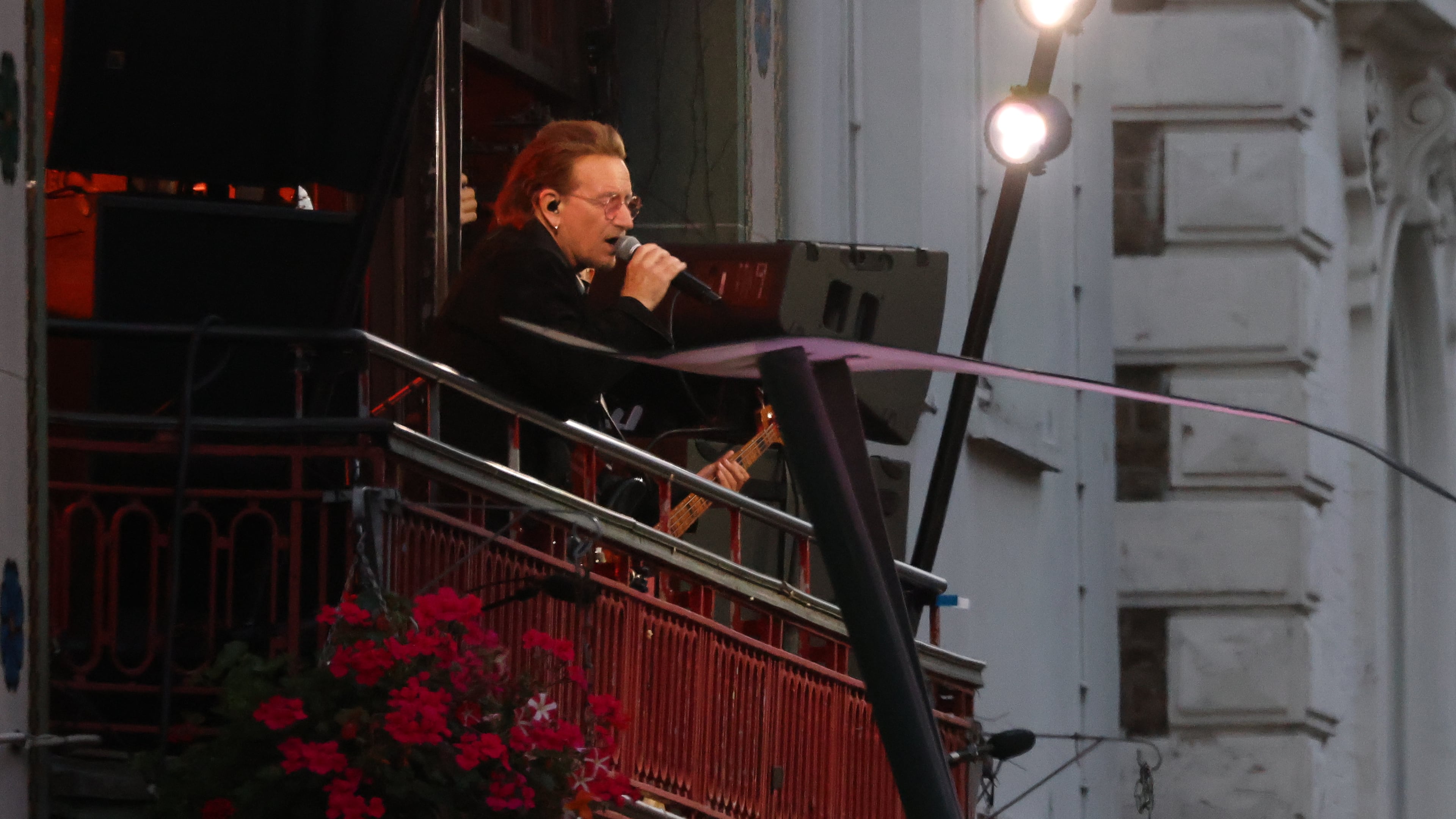 U2 perform an impromptu concert from a balcony in central Dublin, Ireland , Friday, Sept. 25, 2026. (AP Photo/Peter Morrison)